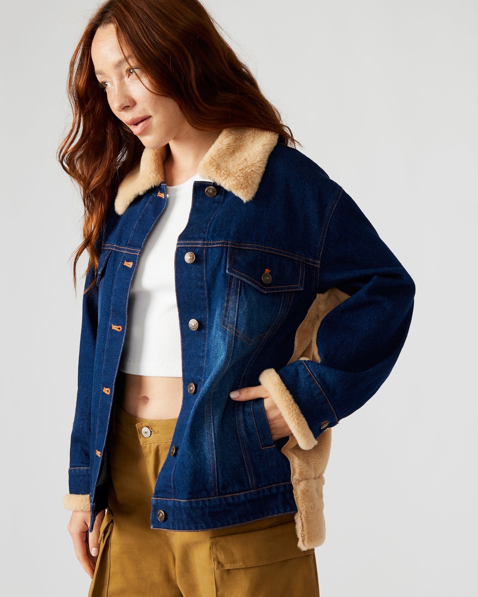 Detail of functional pockets and distressed denim finish