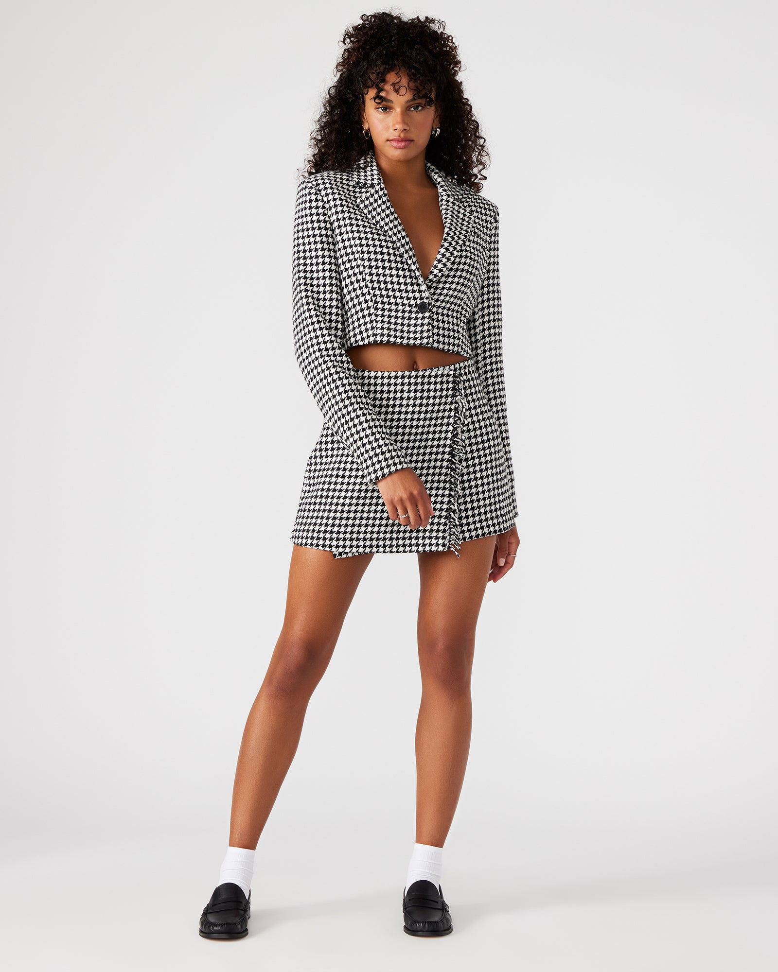 Side angle showing the cropped blazers tailored fit