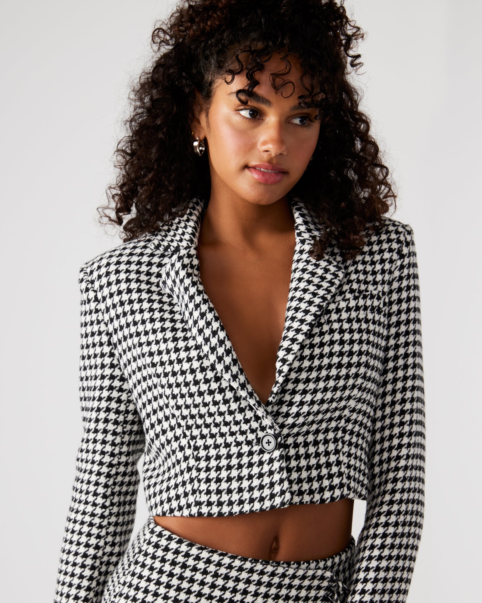 Side angle showing the cropped blazers tailored fit