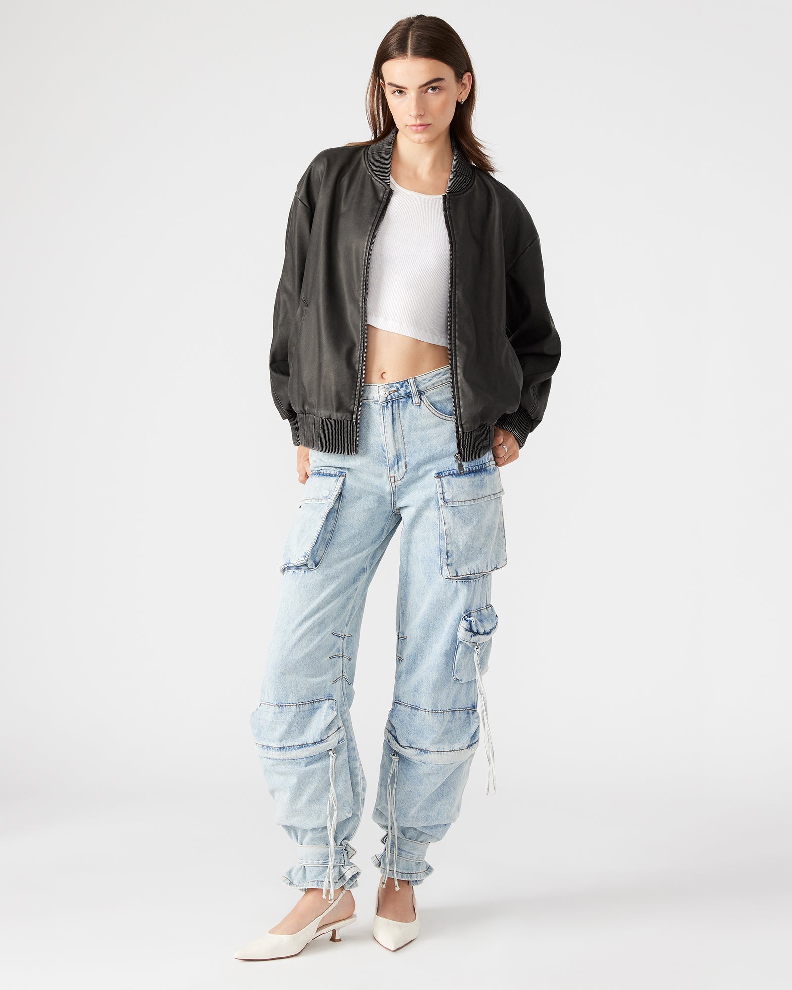 Side profile showing bomber jacket womens fit and length with street styling