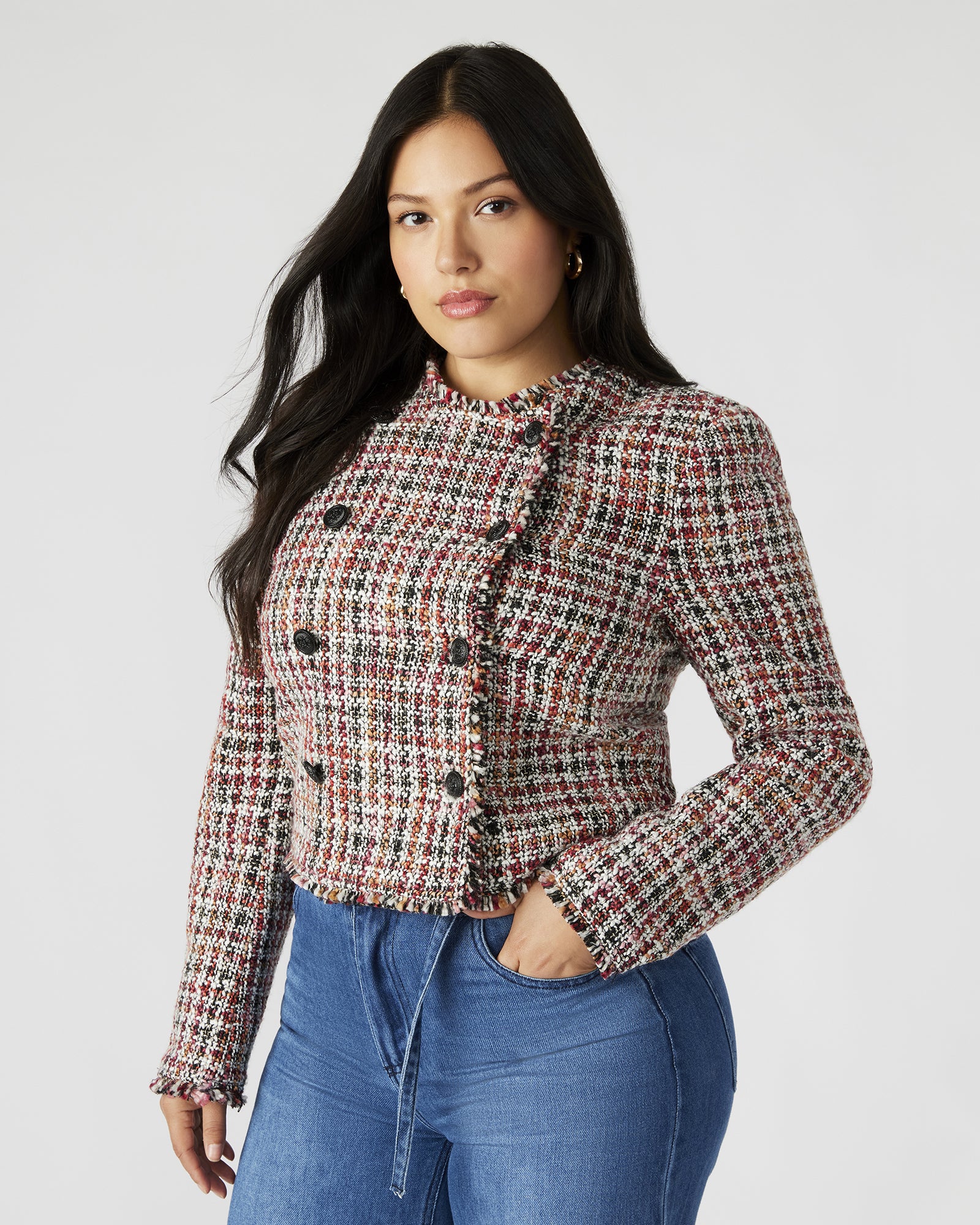 Side view of the Antoinette ladies tweed blazer, showcasing its cropped design and shoulder pads.