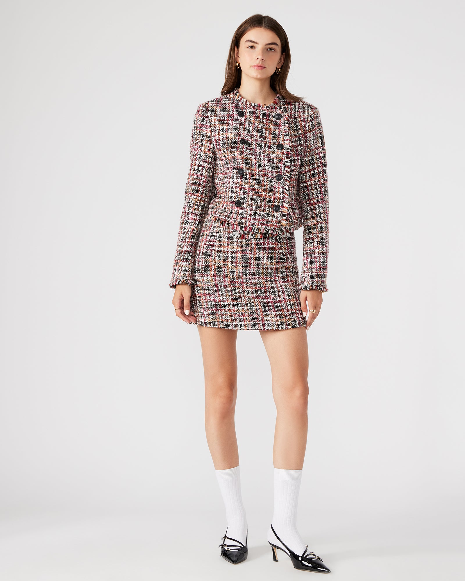 Side view of the Antoinette ladies tweed blazer, showcasing its cropped design and shoulder pads.