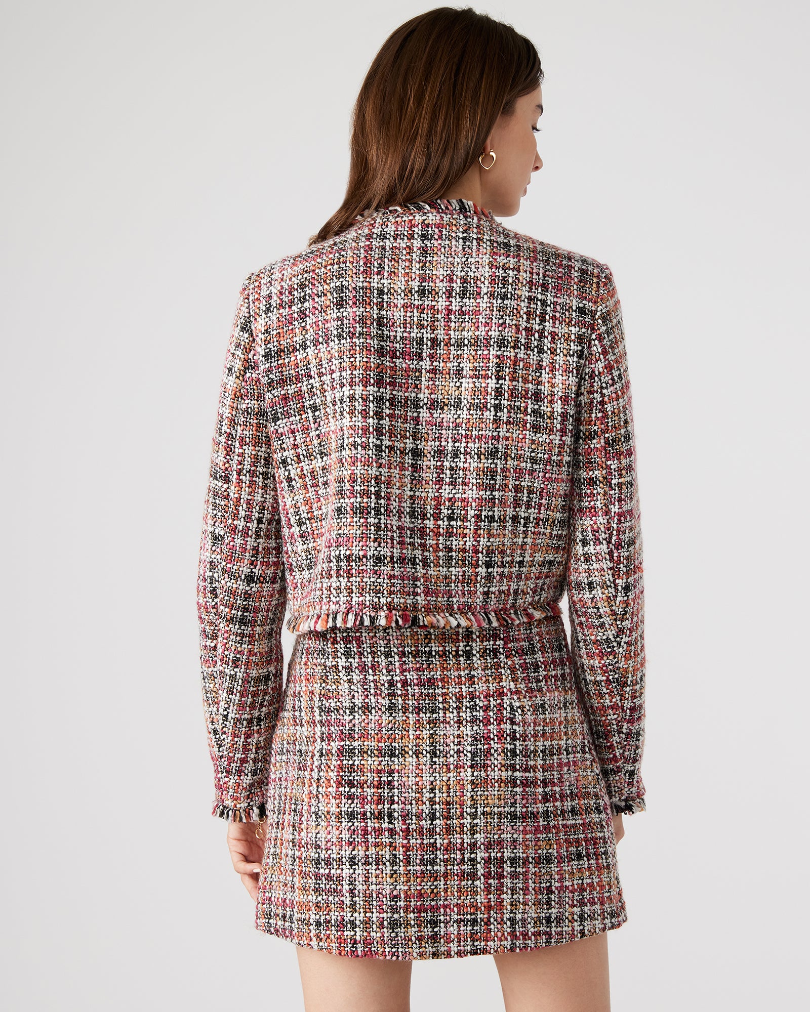 Front view of Antoinette collarless tweed blazer in red multi, highlighting the fray hem and crest buttons.