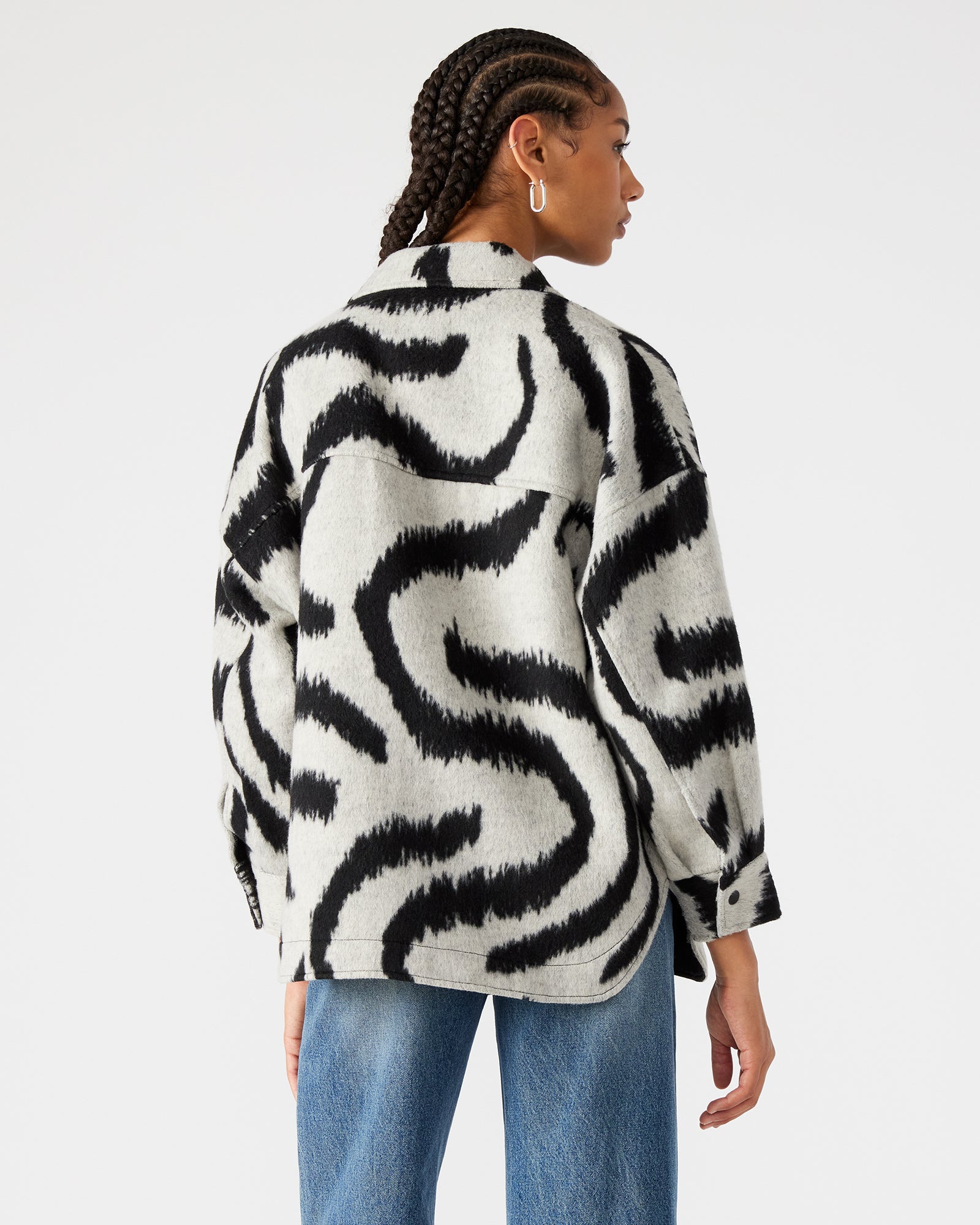 Close-up of the swirl print on the stylish shacket.