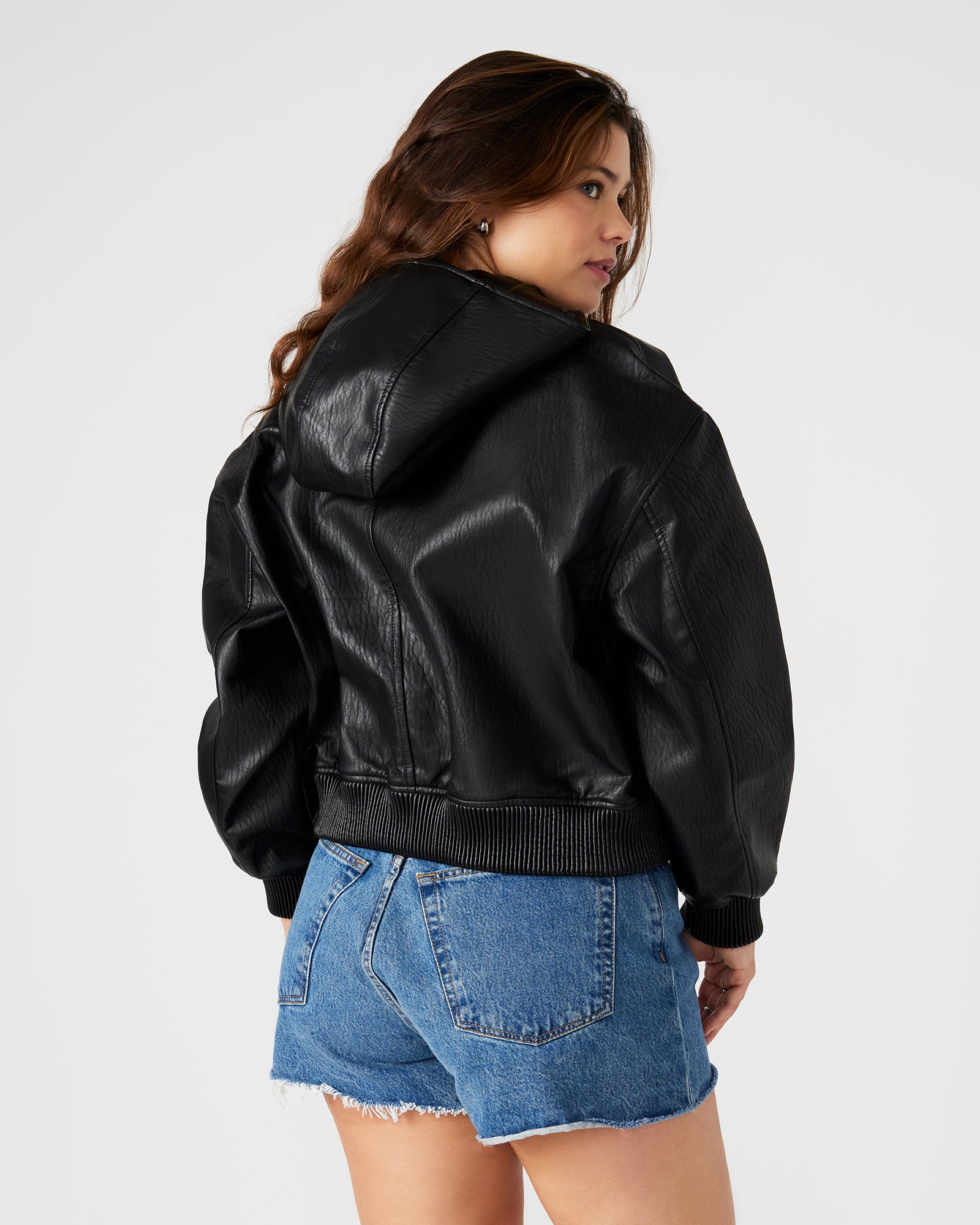 Front view of black cropped bomber jacket on hanger