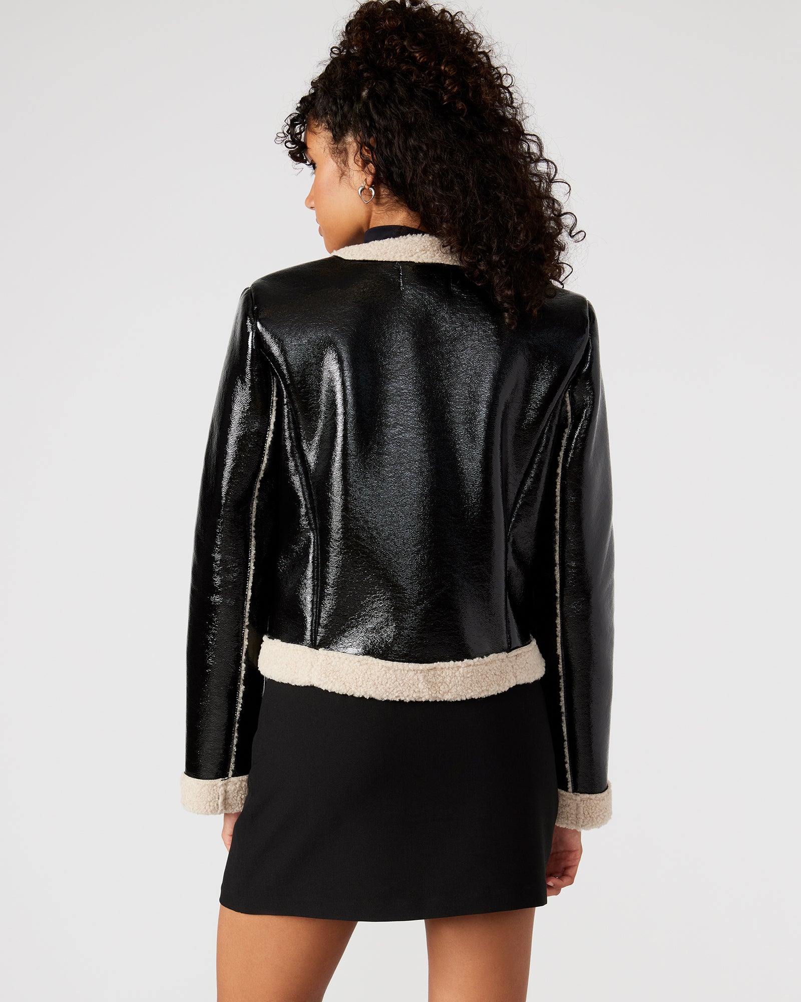 Front view of the faux leather sherpa open jacket, showcasing its collarless design.