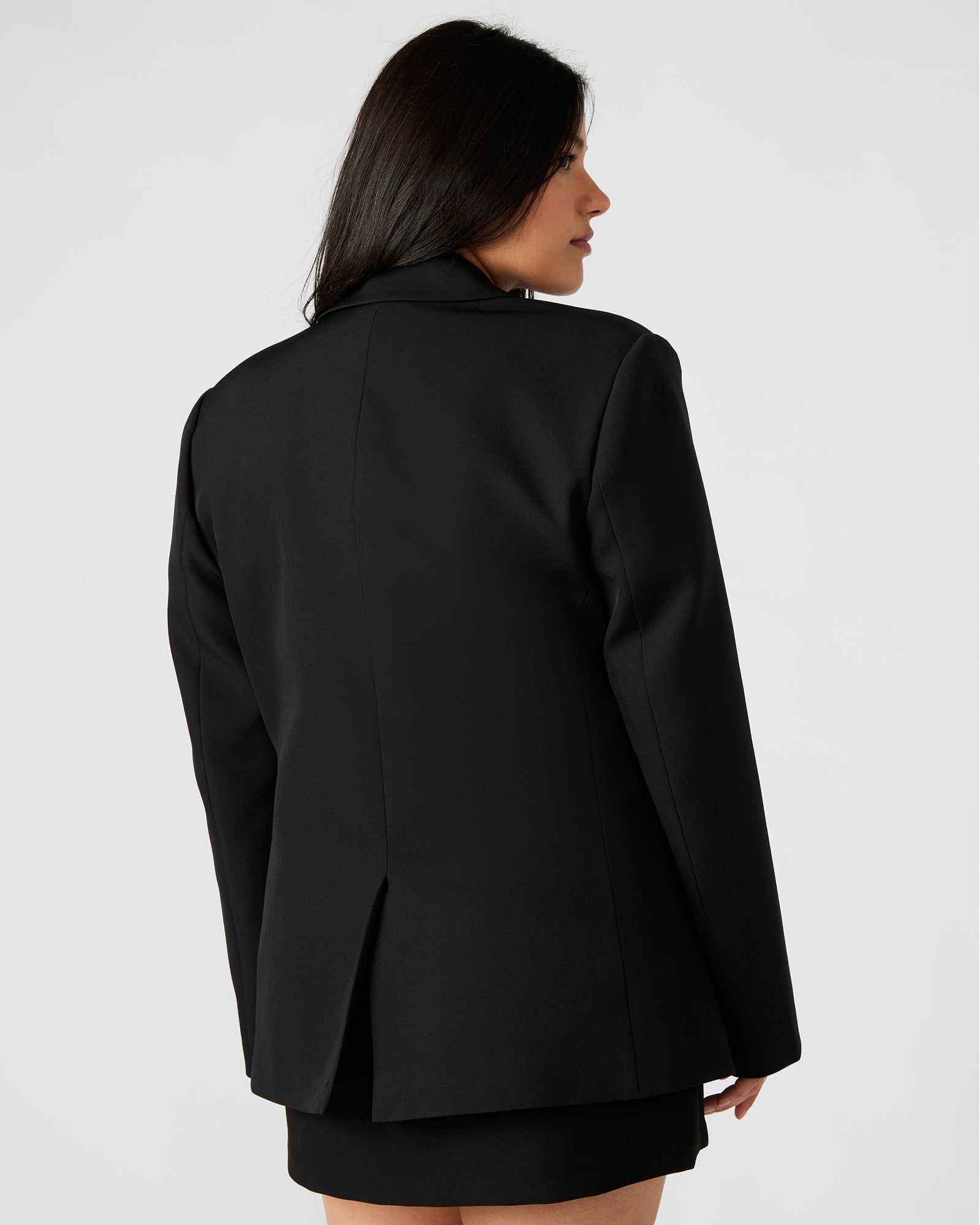 Front view of womens blazer showing rhinestone fringe and tailored fit