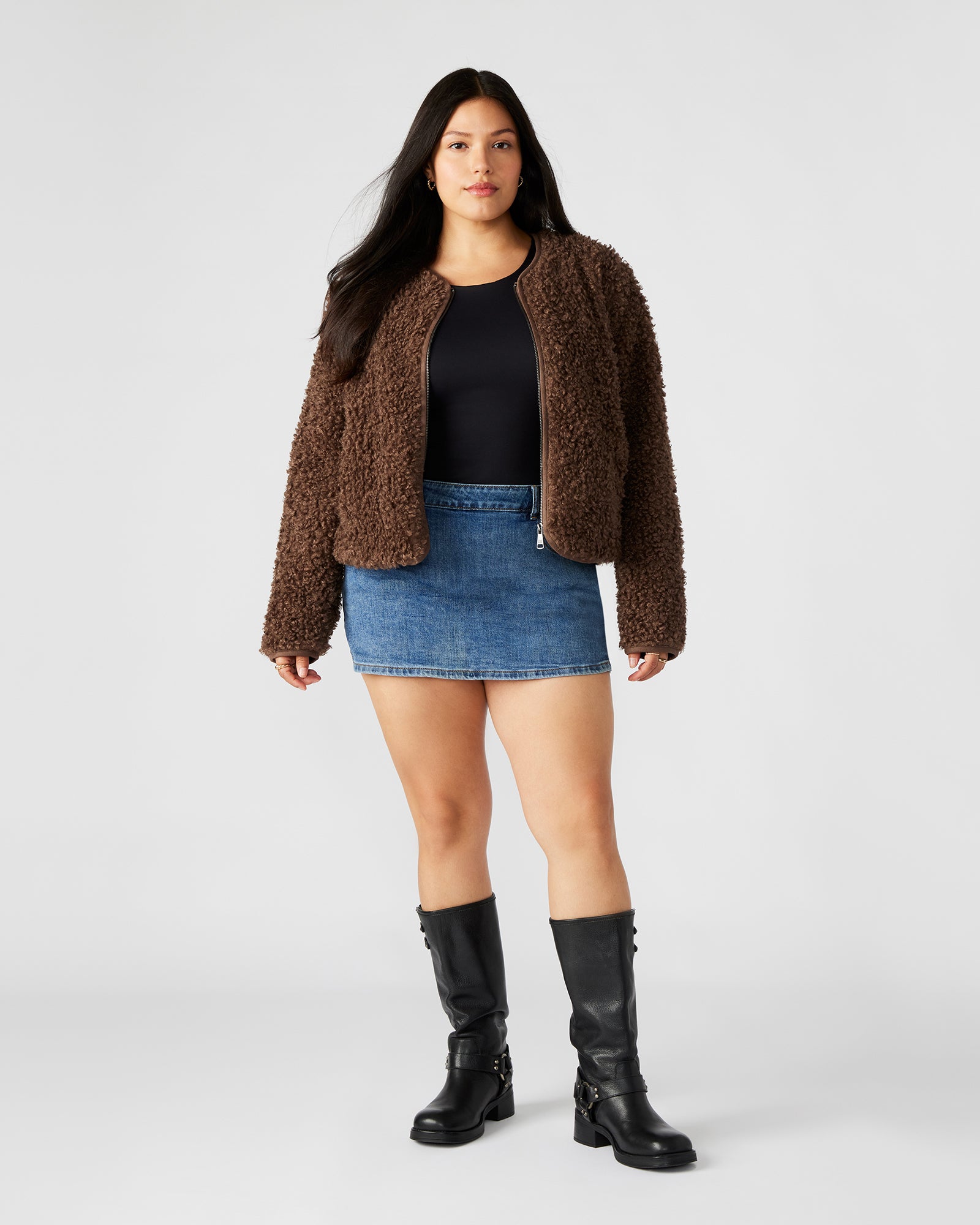 Side view showing the jackets tailored fit and textured brown suede fabric