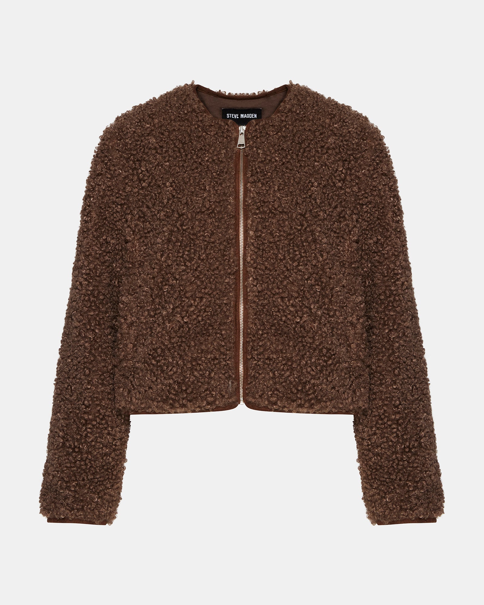 Full-body shot of the sherpa jacket styled with jeans for a casual winter look
