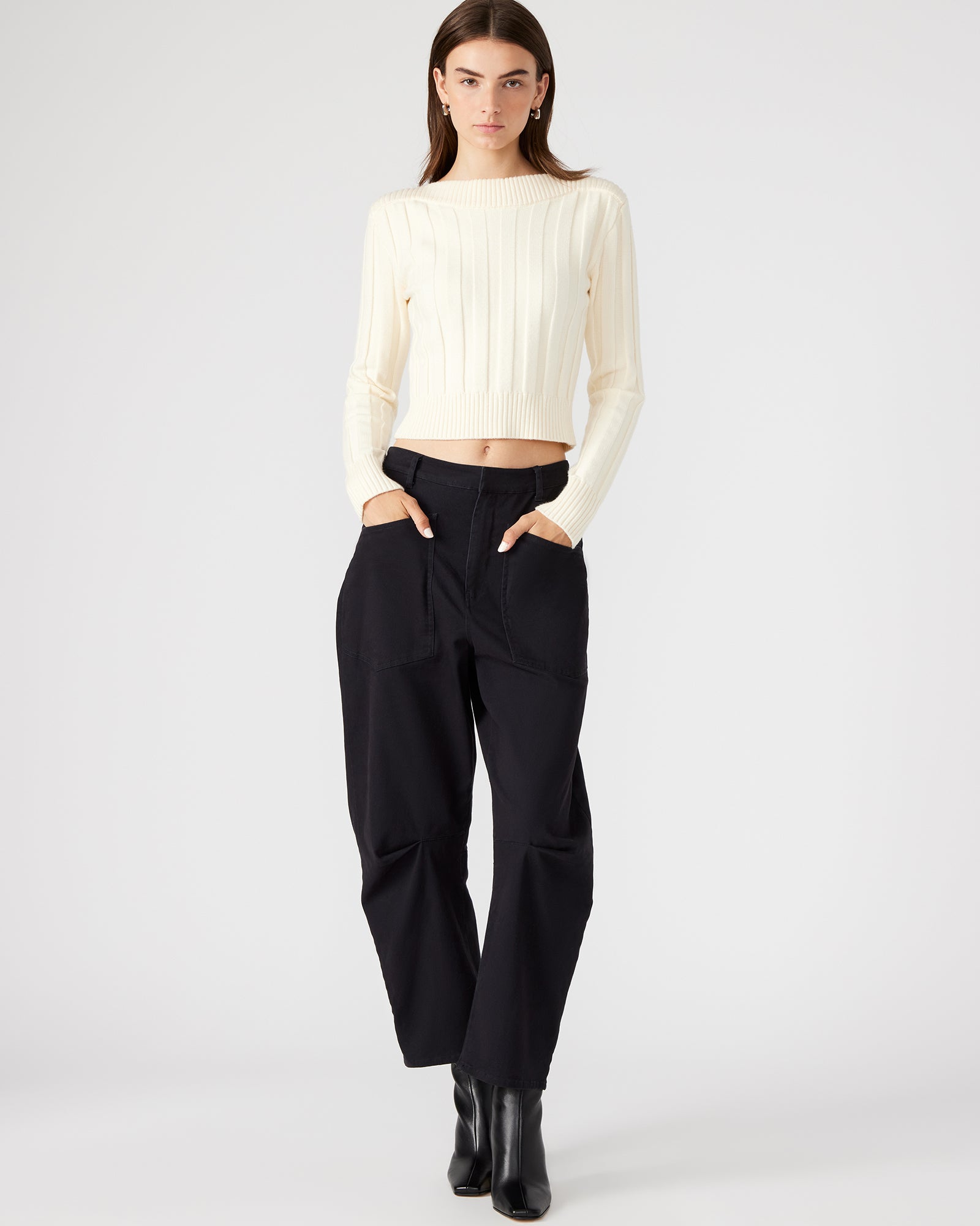 Front view of stylish cotton twill barrel leg pants in black, showcasing utility pockets.