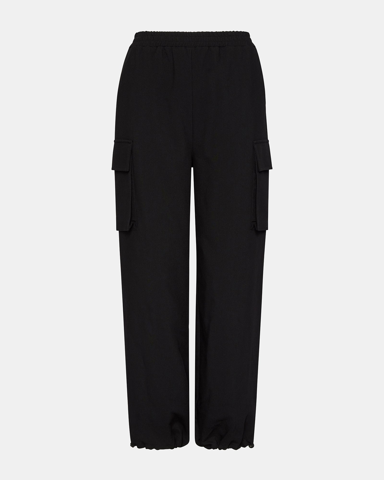 Side view of womens cargo pants worn on forest trail