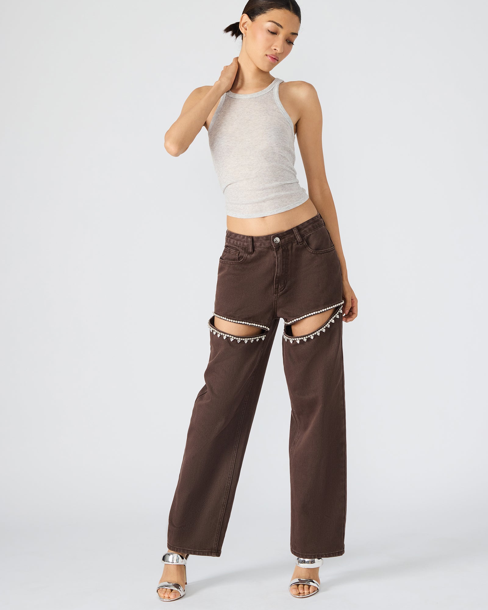 Front view of cocoa brown wide leg jeans with rhinestone details, styled for a casual look.