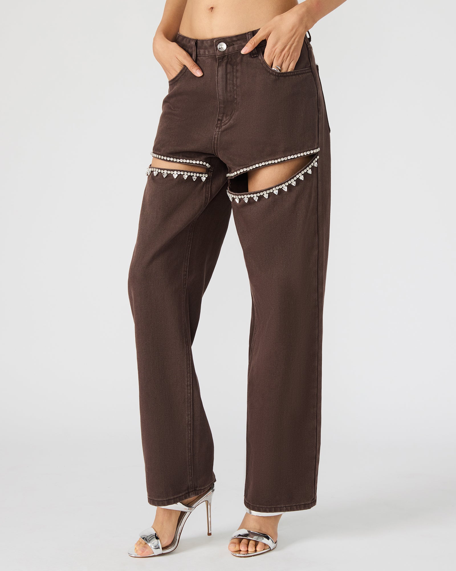 Close-up of rhinestone accents on cocoa brown wide leg jeans, highlighting their unique design.