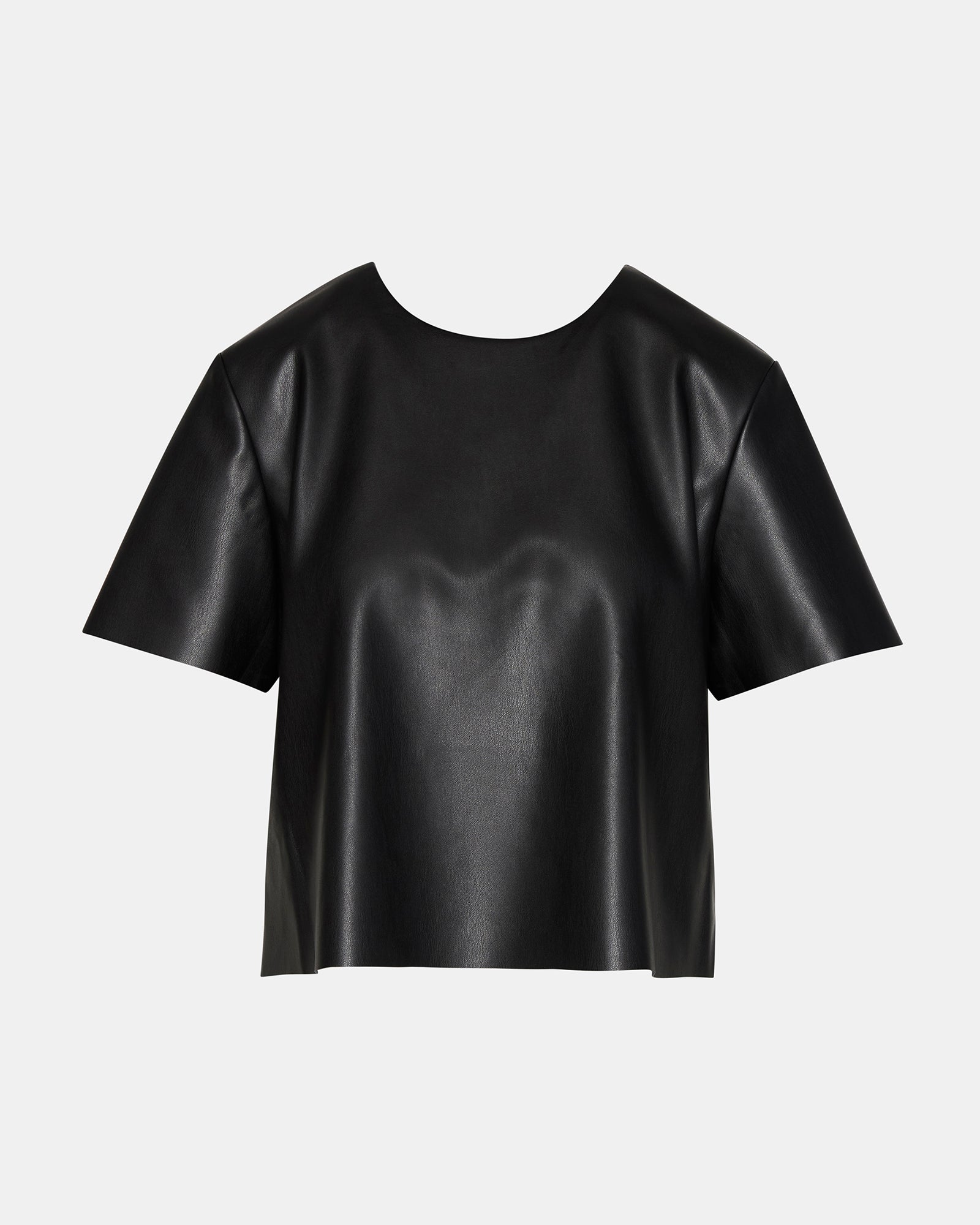 Model wearing the chic faux leather top in a casual setting.