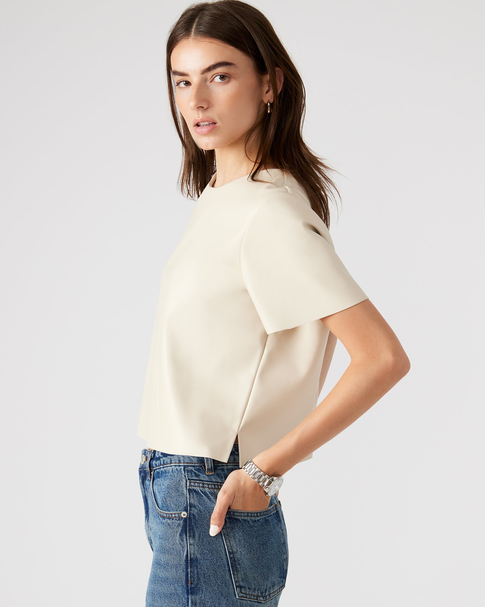 Styled outfit featuring the womens faux leather top with jeans