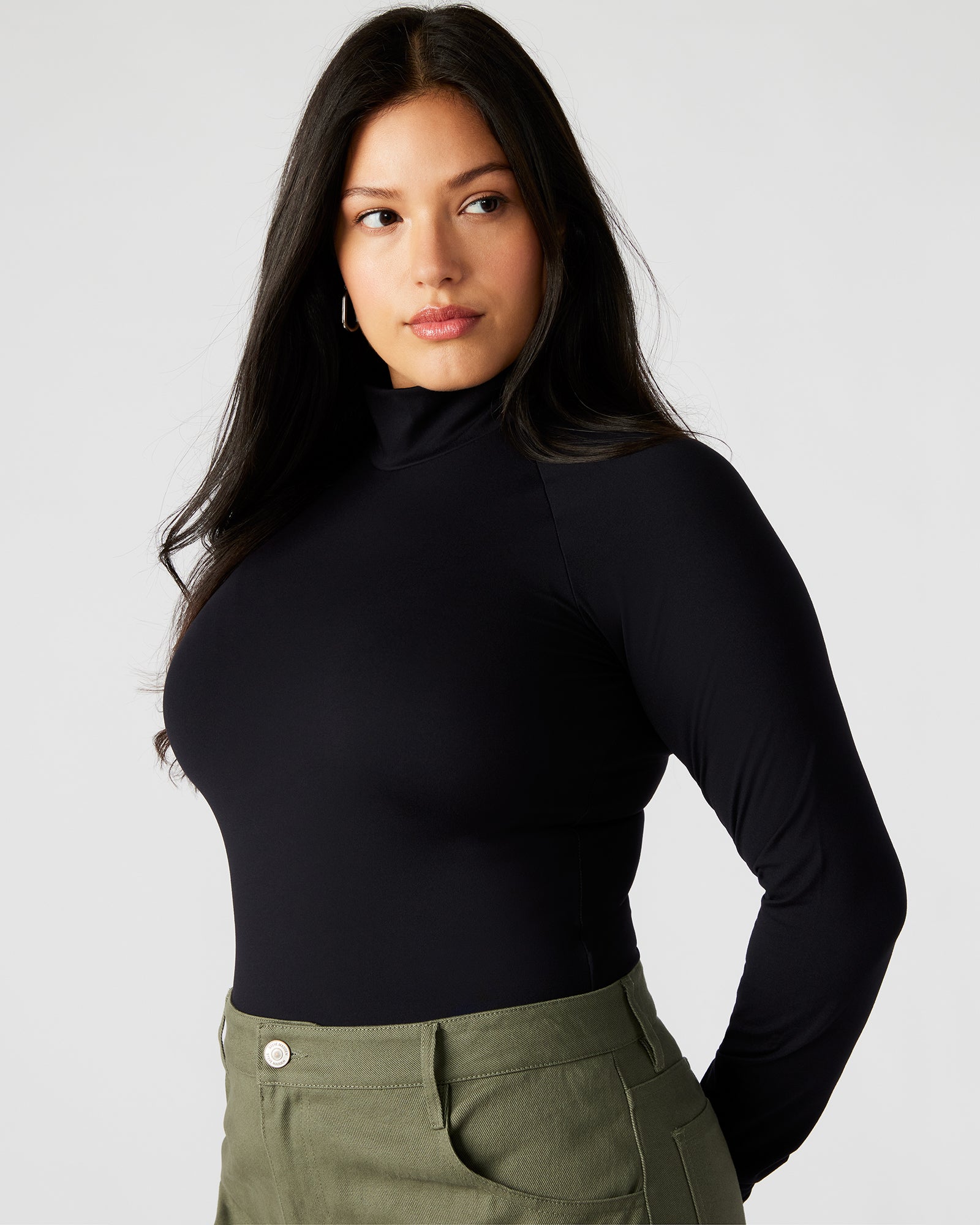 Close-up of the snap closure on the black bodysuit