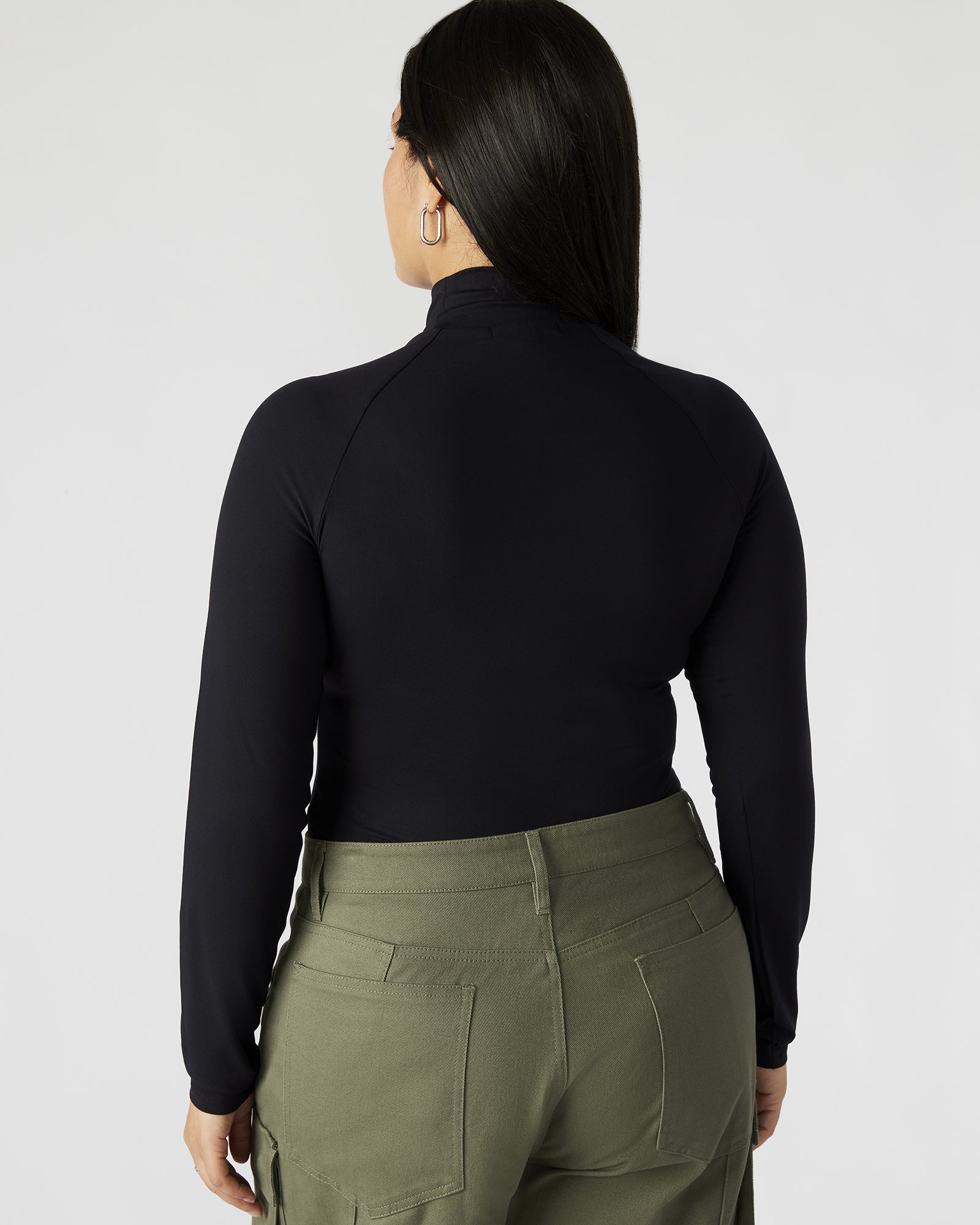 Front view of the black long sleeve bodysuit showing the mock neck design