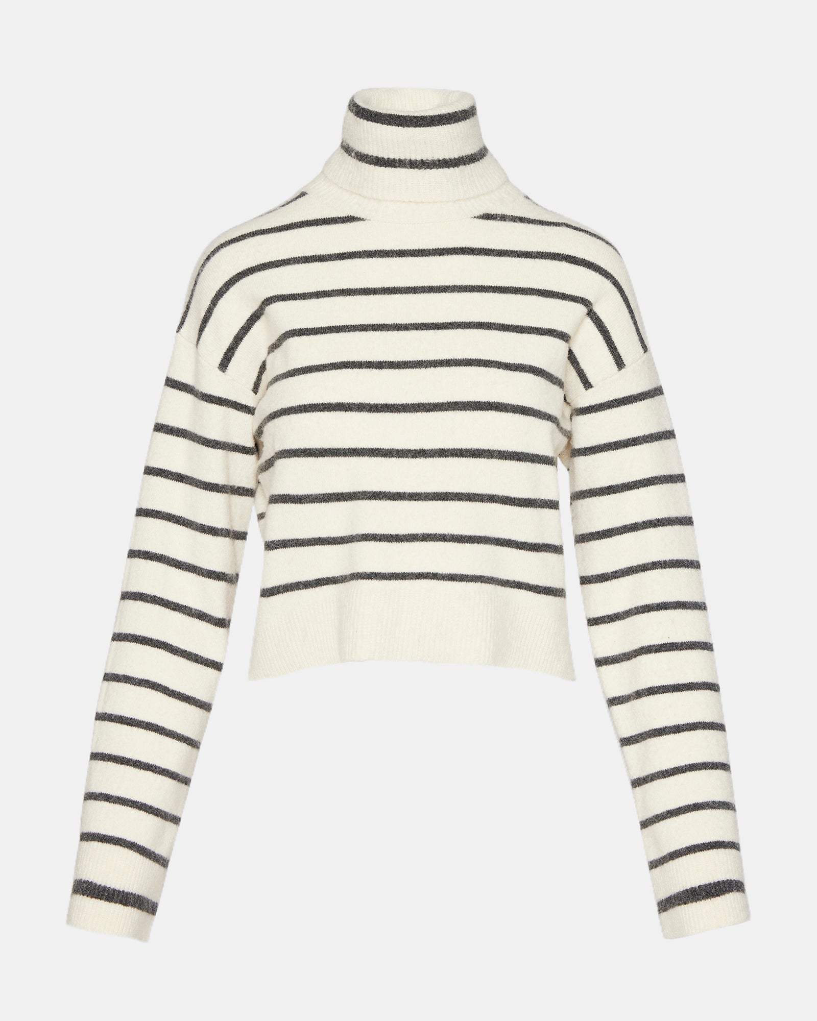 Close-up of the fabric texture of the black and white striped turtleneck sweater.