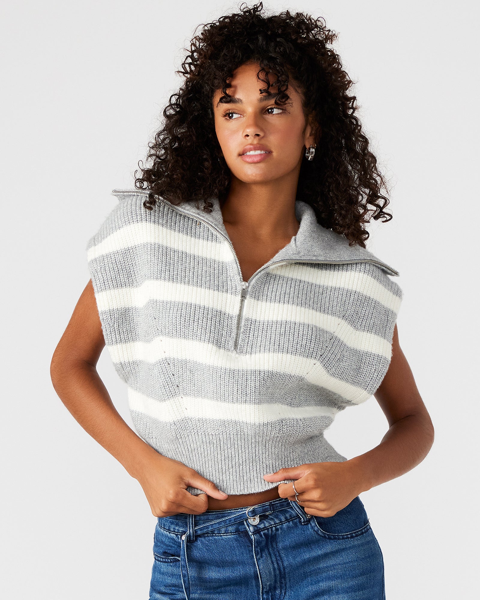 Side angle showcasing sleeveless cut and relaxed fit of the EASTON sweater.