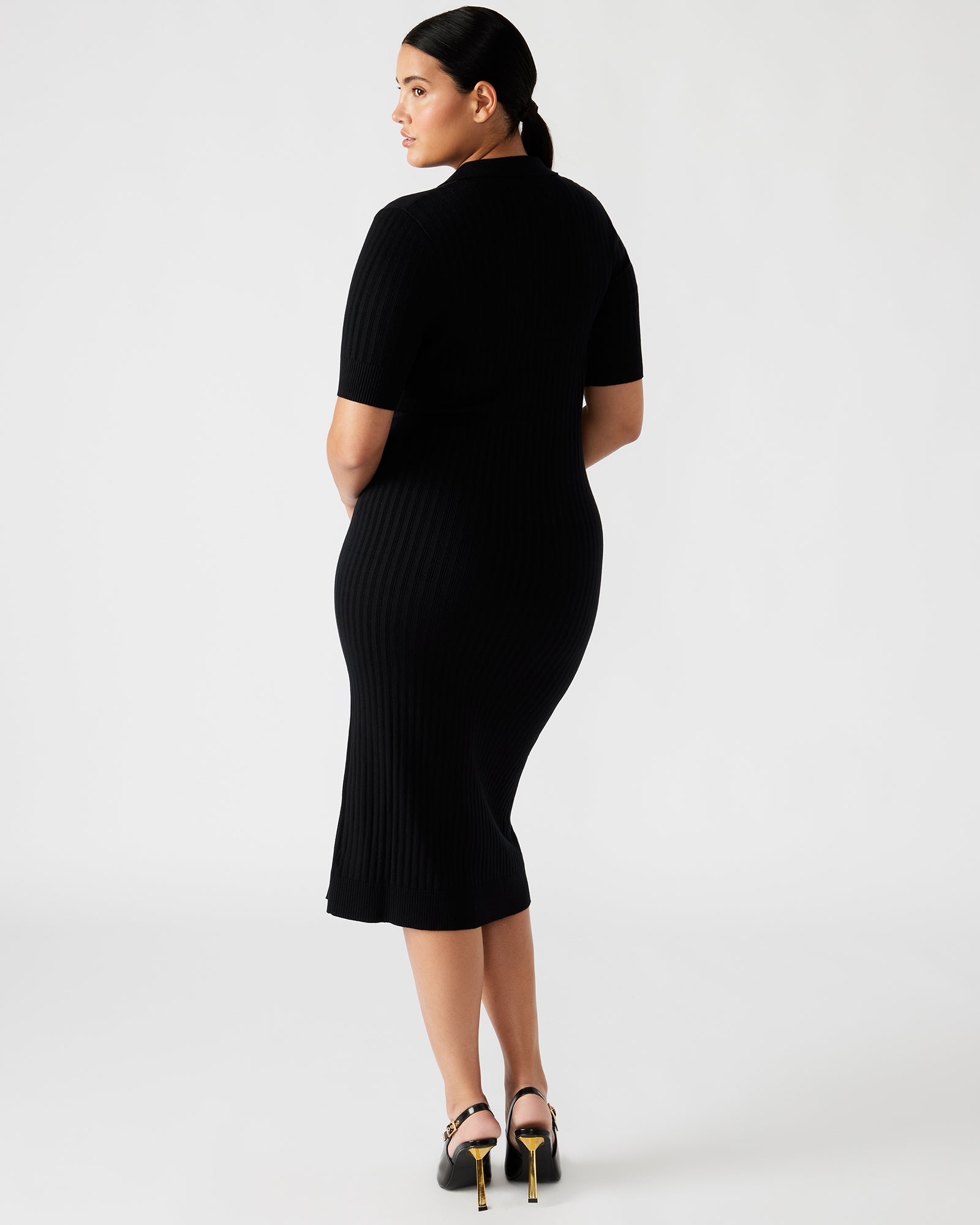 Close-up of the textured stitching on the black midi dress, highlighting its sophisticated design.