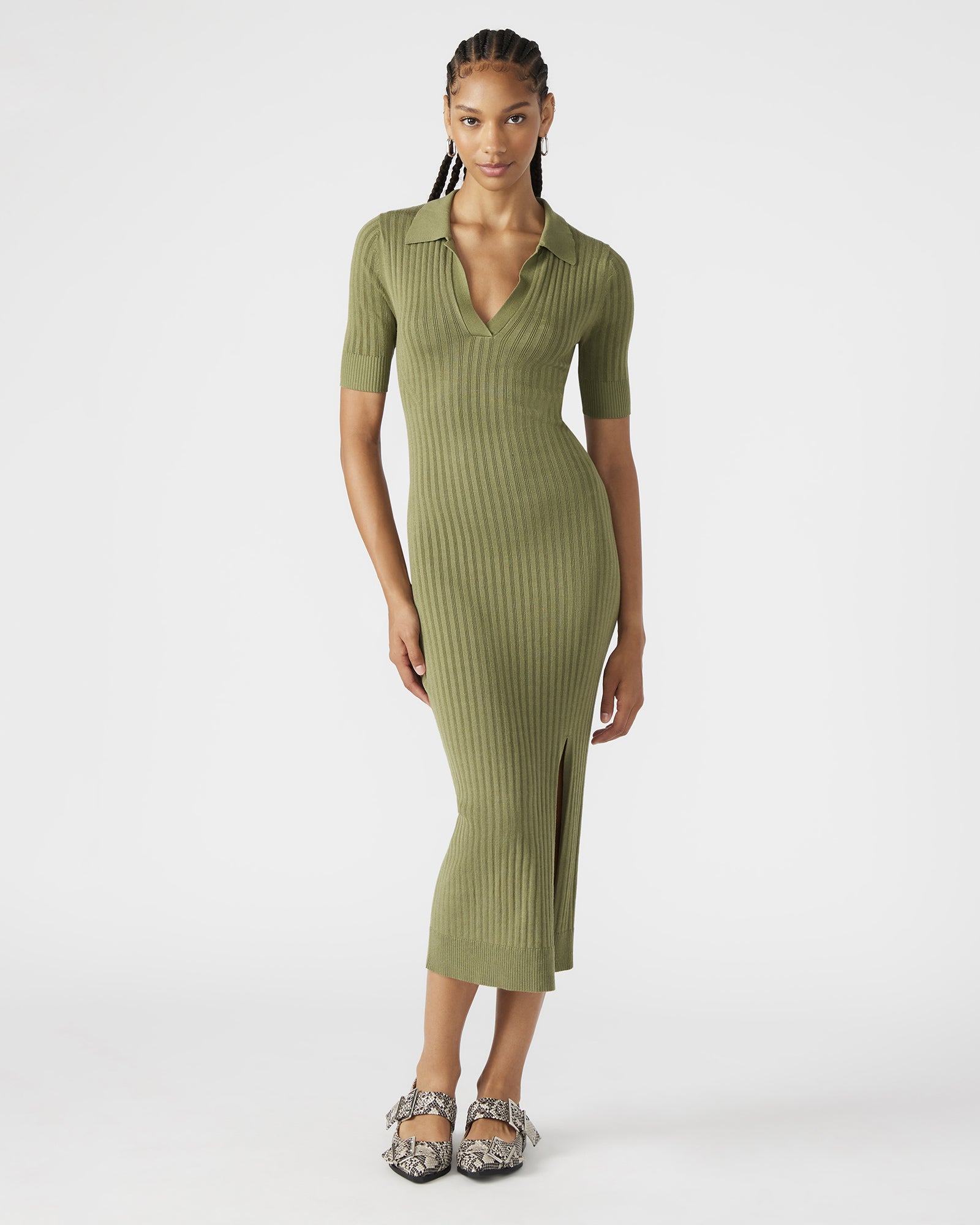 Side view of the ribbed knit olive dress showcasing its front slit.