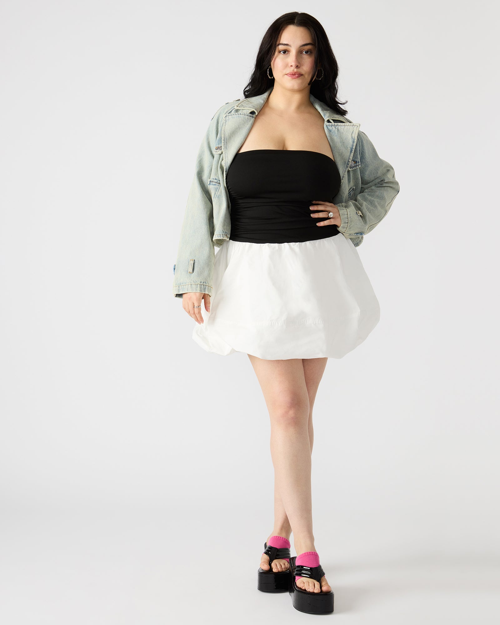 Side view of the Amari strapless mini dress, showing the ruched bodice and secure fit.