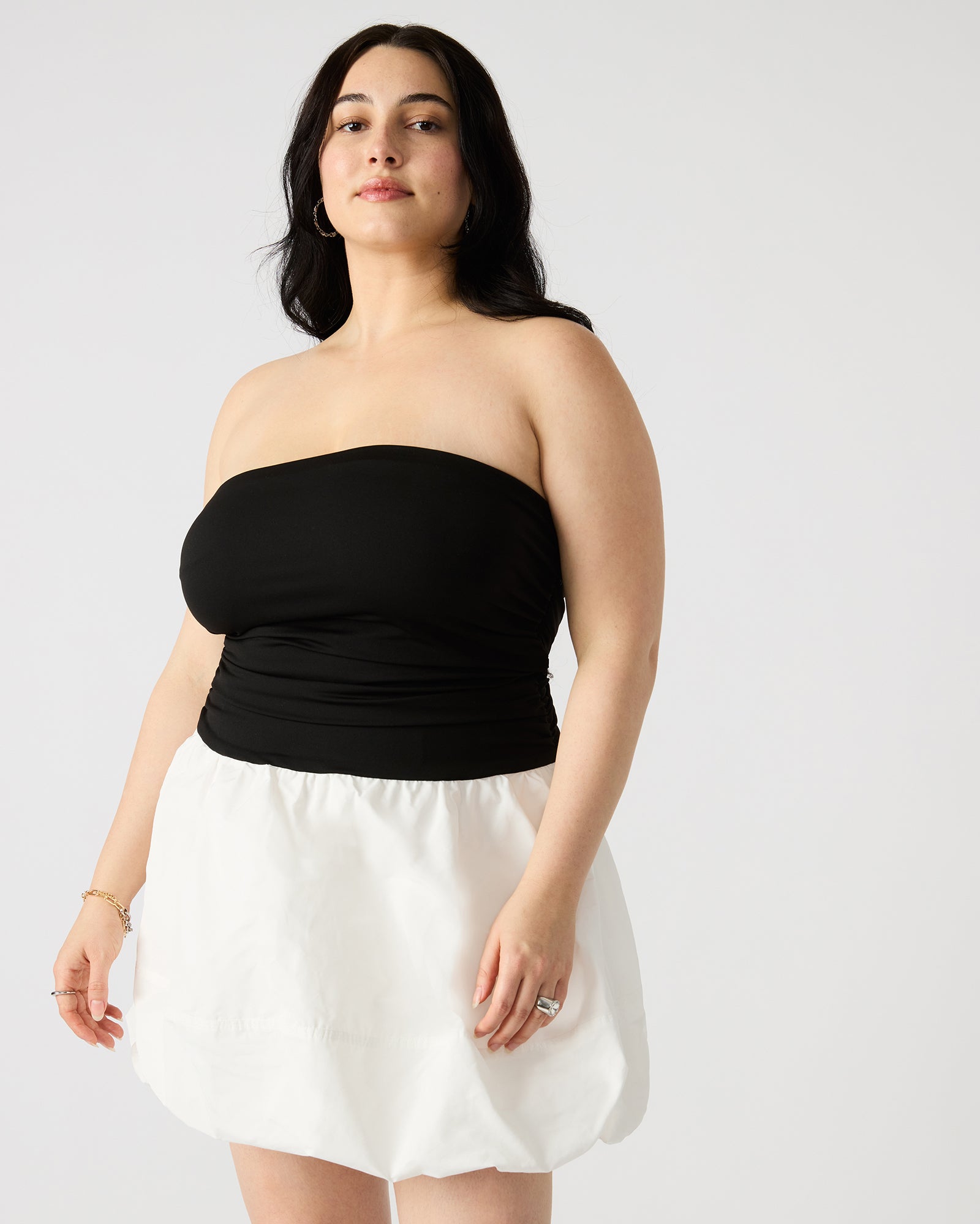 Back view of the Amari strapless mini dress, emphasizing the elegant design and side zip.