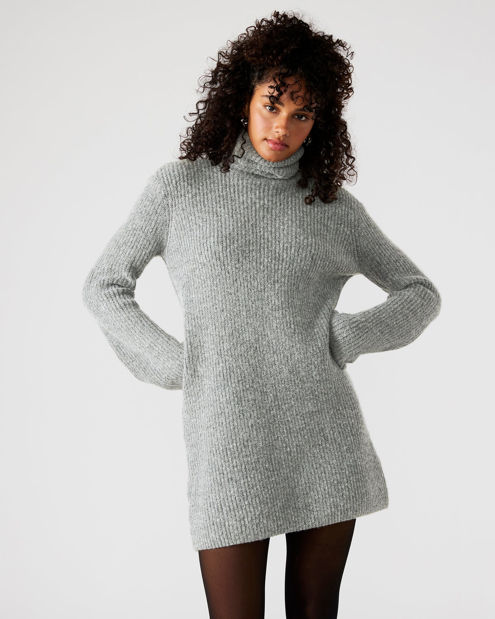 Side angle showing flared sleeves of the grey mini sweater dress.