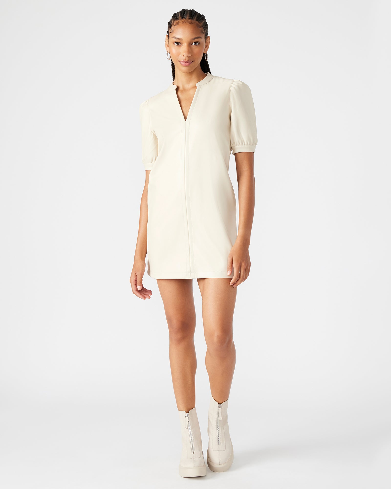 Side view showing the v-neck dress pockets on the street