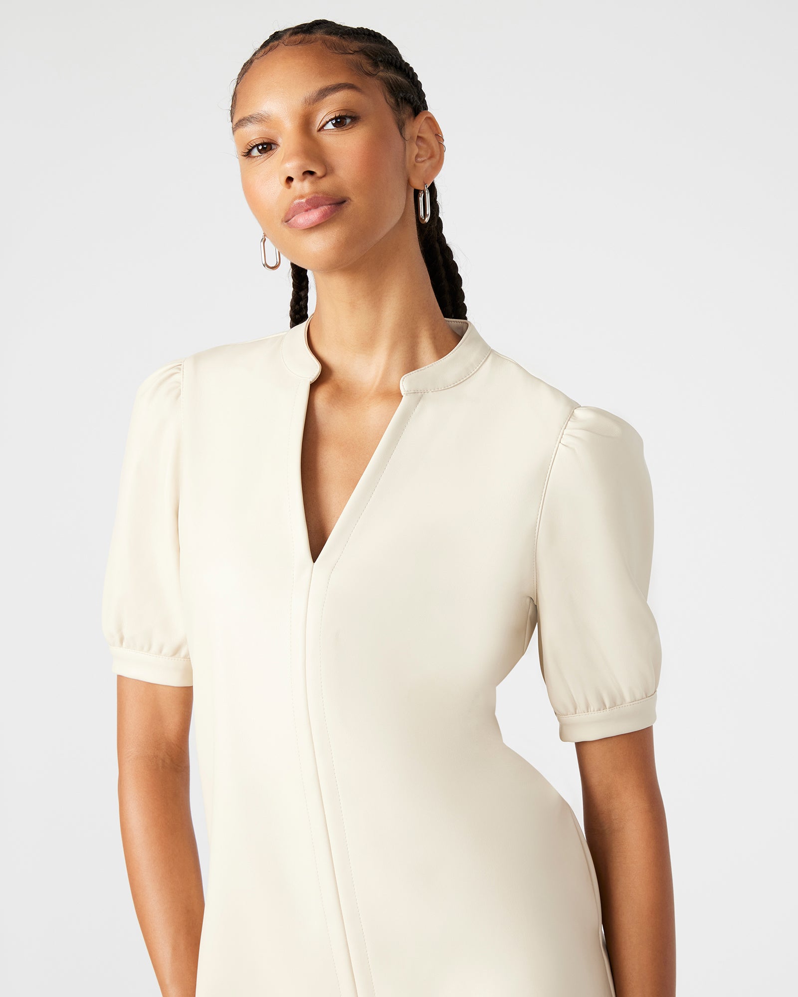 Side view showing the v-neck dress pockets on the street