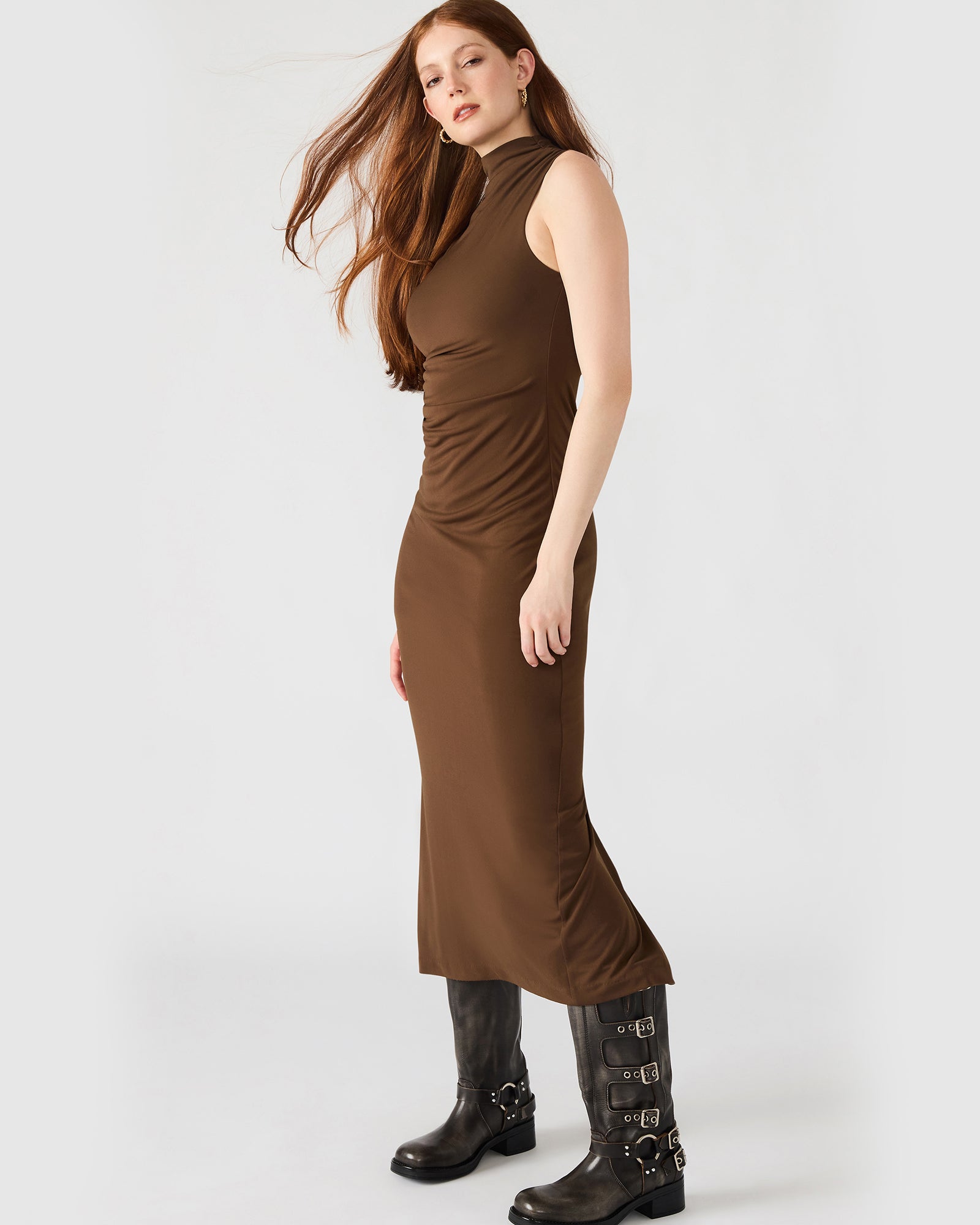 Close-up of the back zipper closure on the brown midi dress.