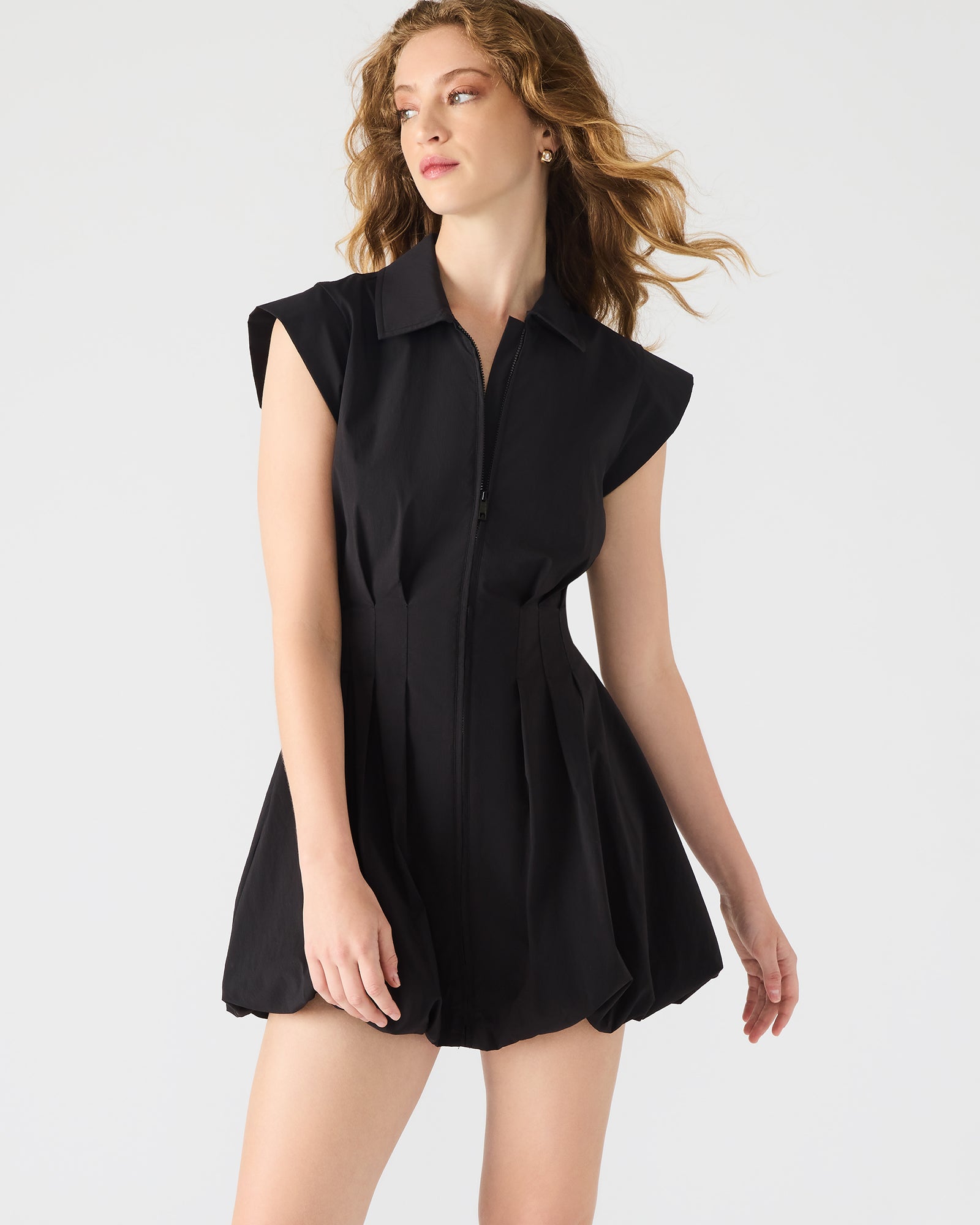 Front view of Dyanne black zip front mini dress showcasing the bubble hem.