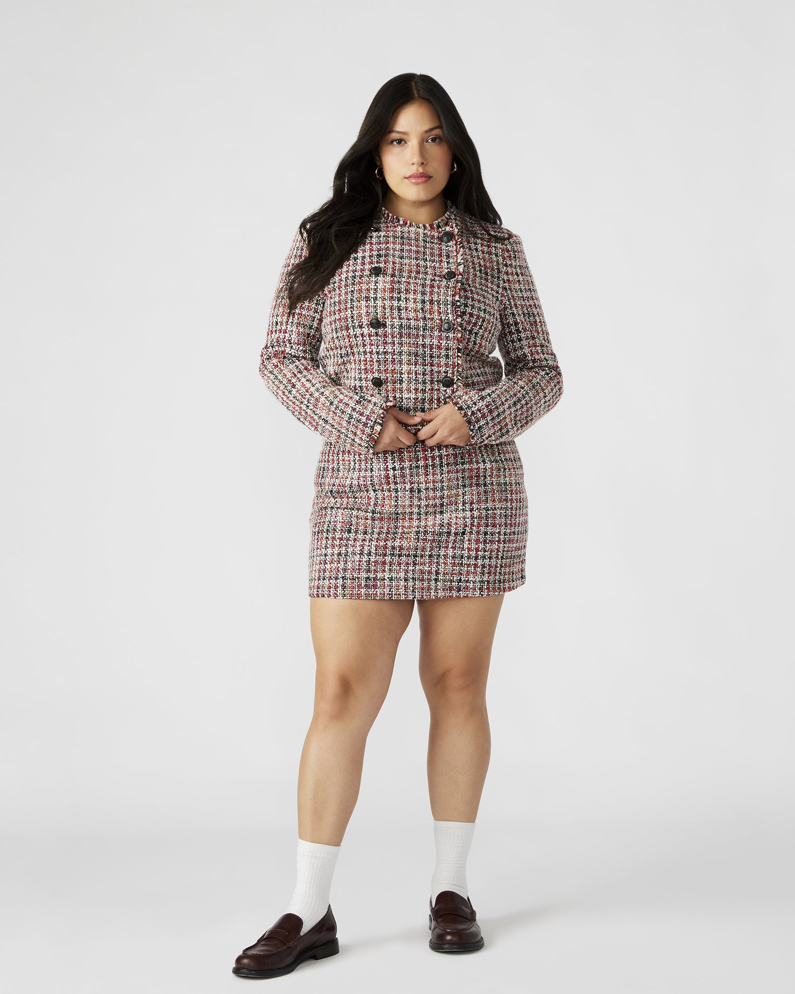 Side view showcasing the side zip closure of the MATTEA mini skirt.