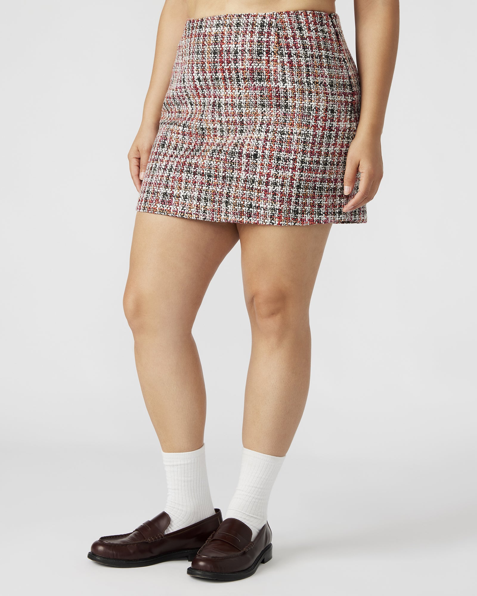 Front view of MATTEA colorful mini skirt with speckled design.