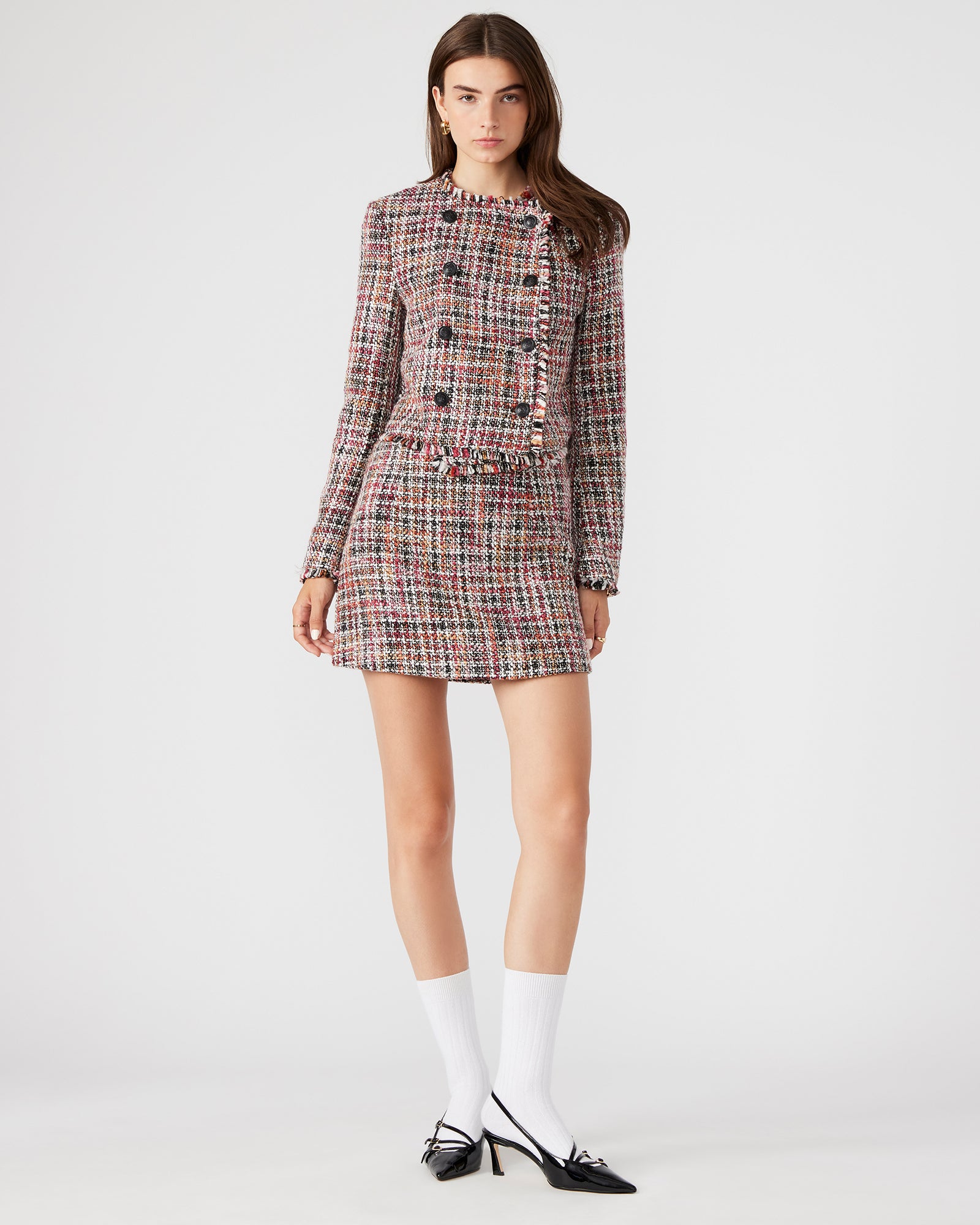 Front view of MATTEA colorful mini skirt with speckled design.