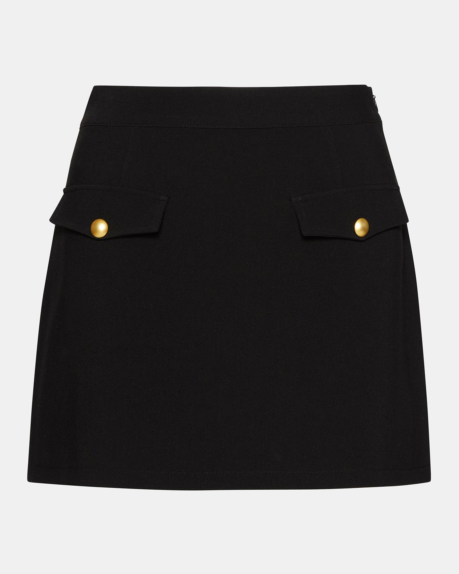 Model wearing the black pleated mini skirt in a stylish urban setting.