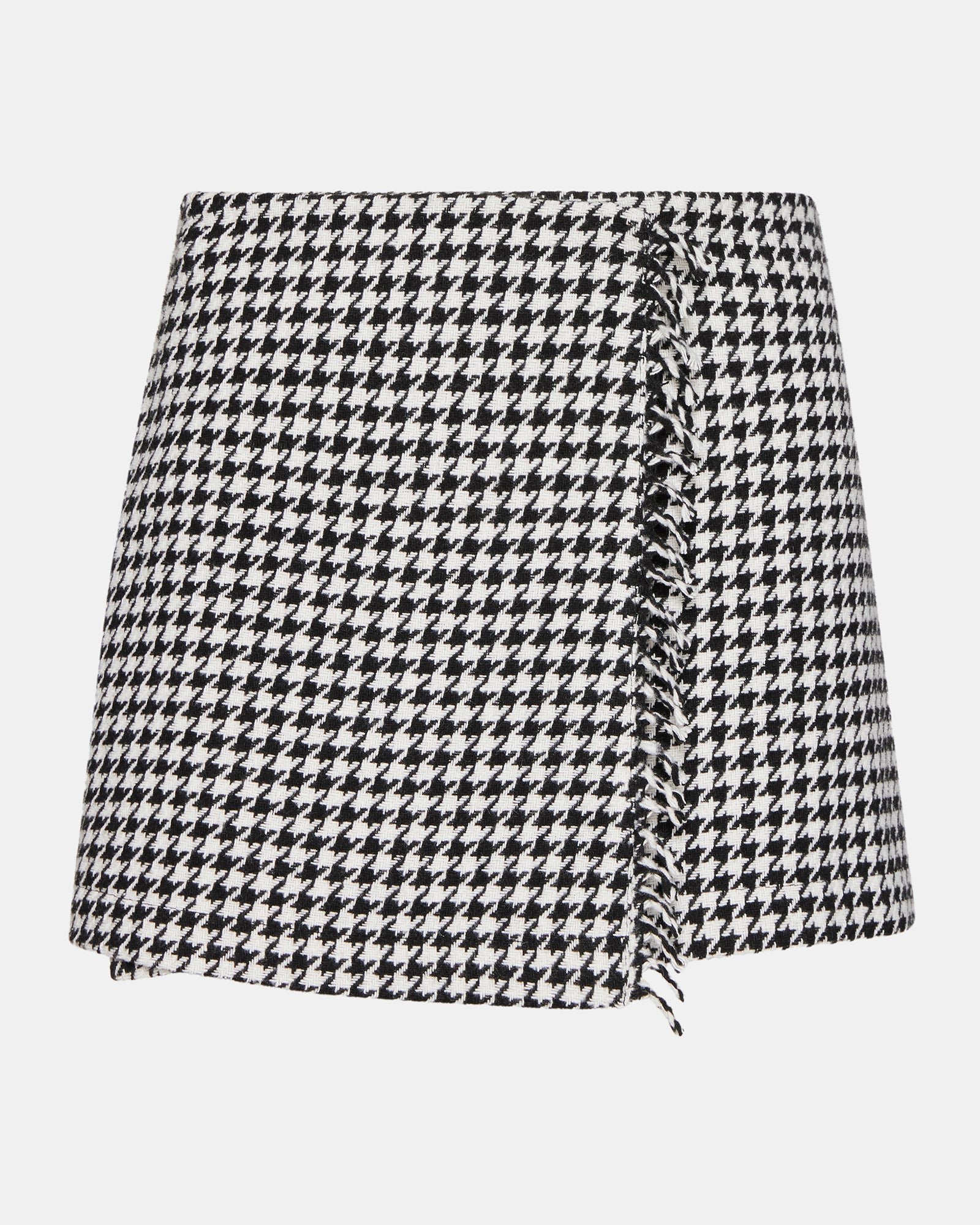 Full view of the mini skirt styled with boots for fall fashion