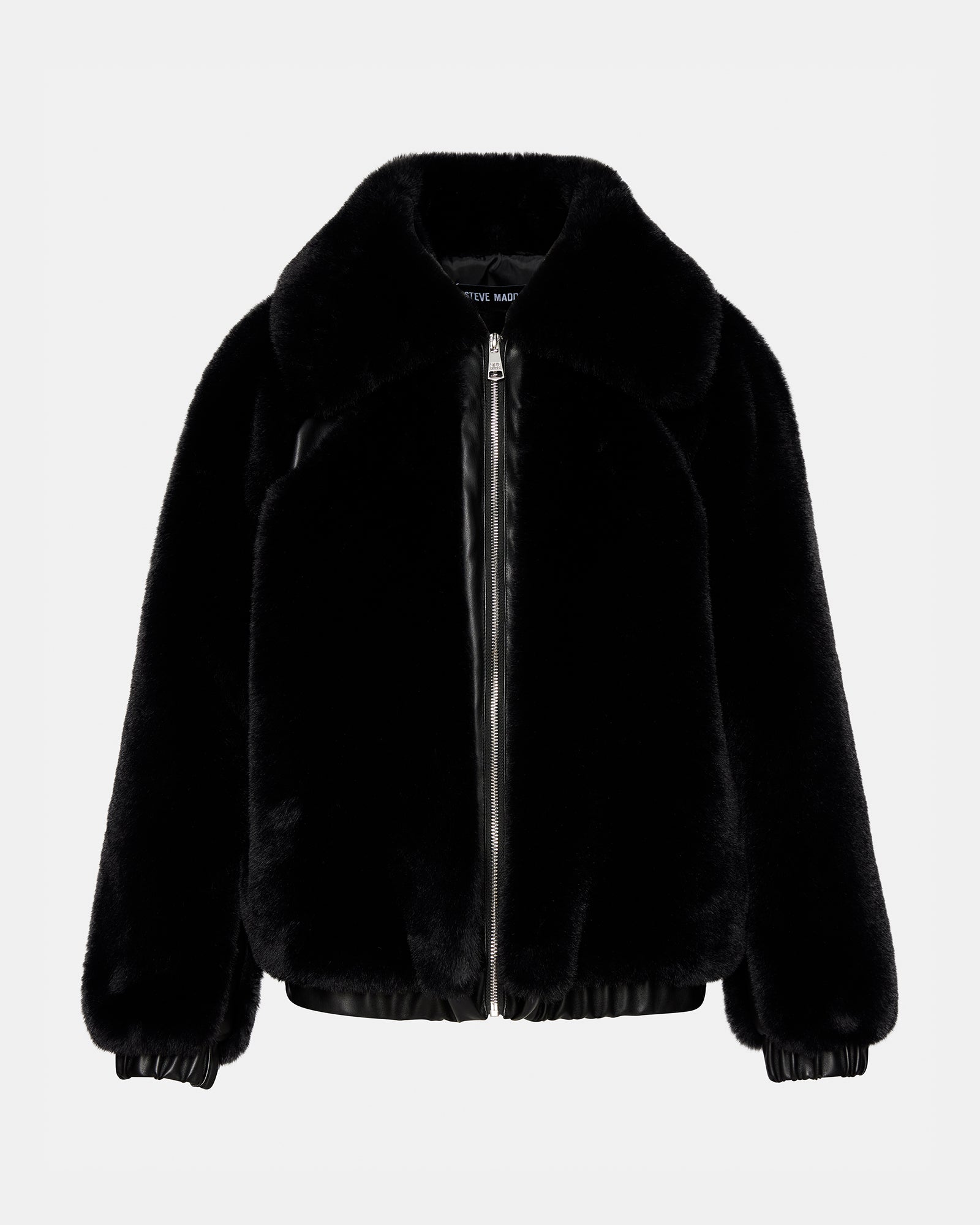 Side view of the black zip-up jacket, highlighting the collared neckline and long sleeves.