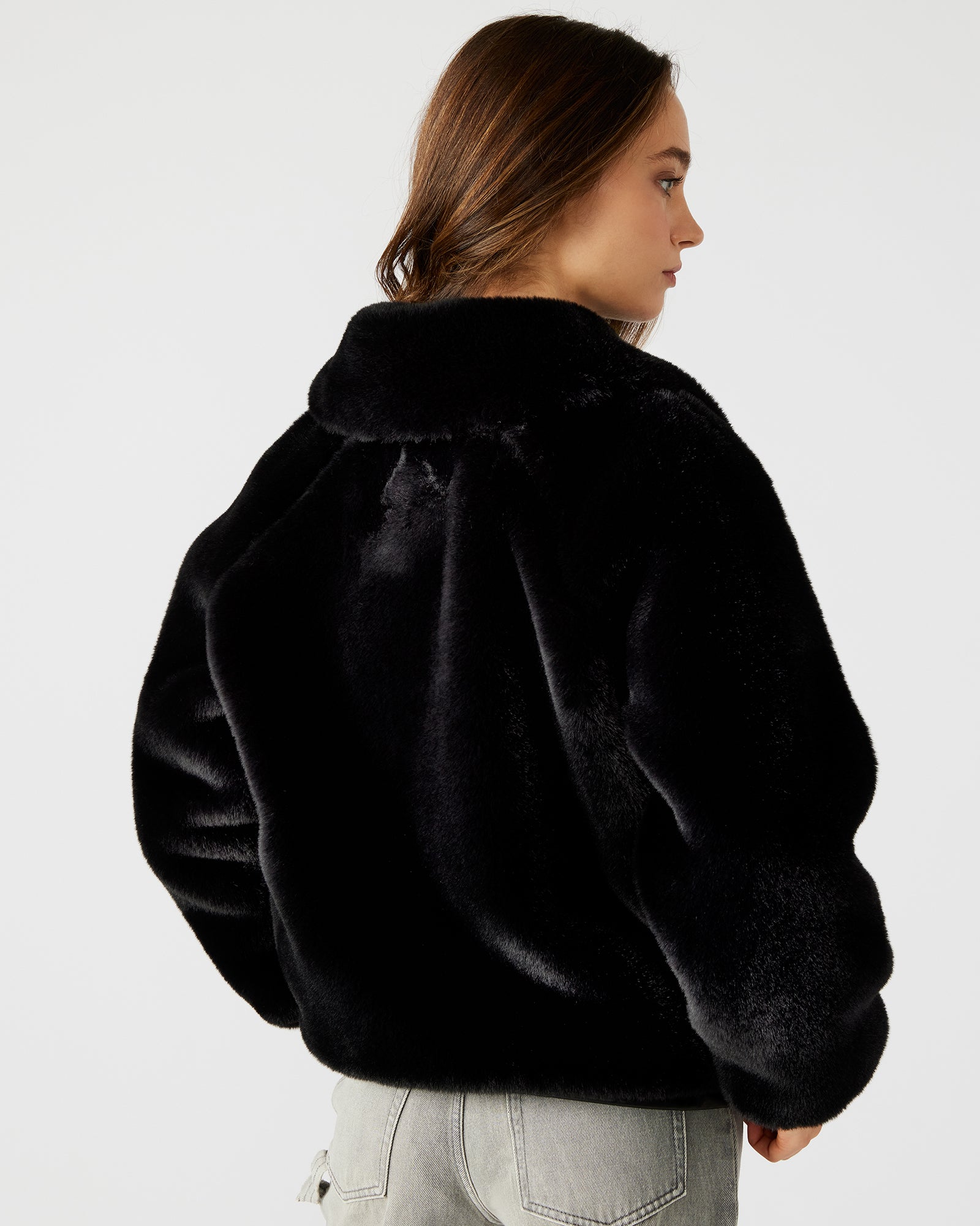 Model wearing the luxurious furry jacket, demonstrating its flattering fit and functional pockets.