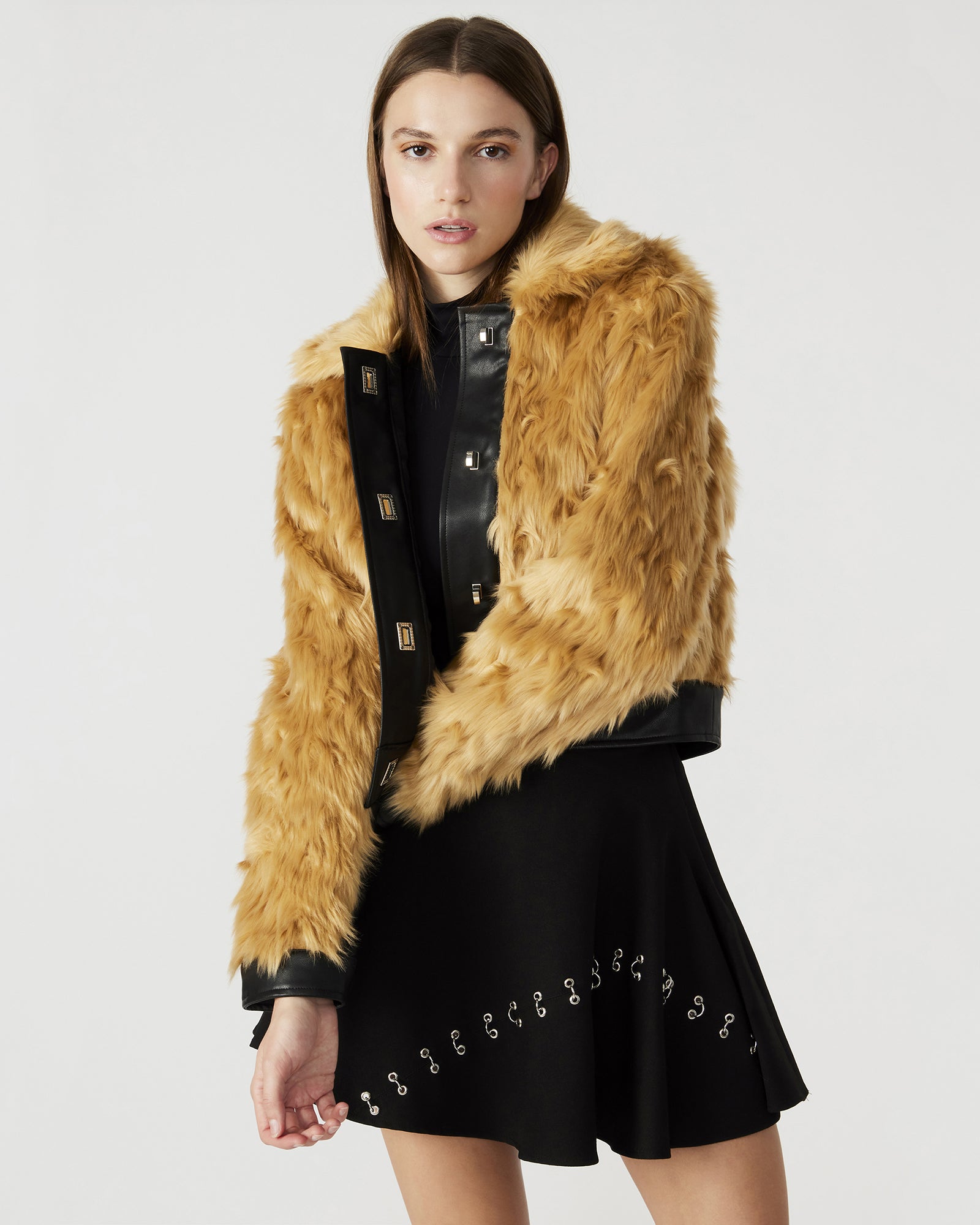 Side view of the NIMBA faux fur jacket, highlighting the long sleeves.