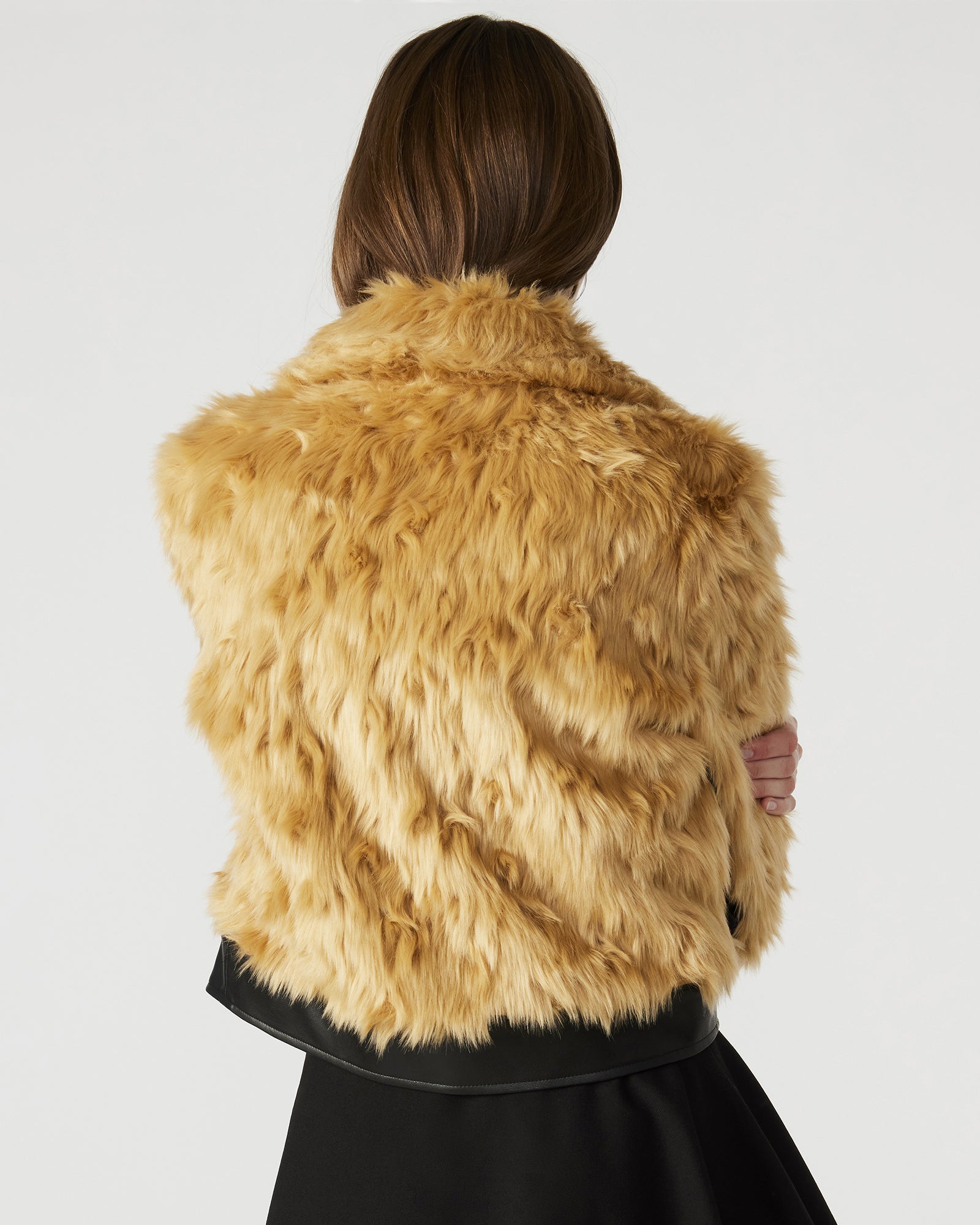 Close-up of the turn-lock closure on the NIMBA faux fur jacket.