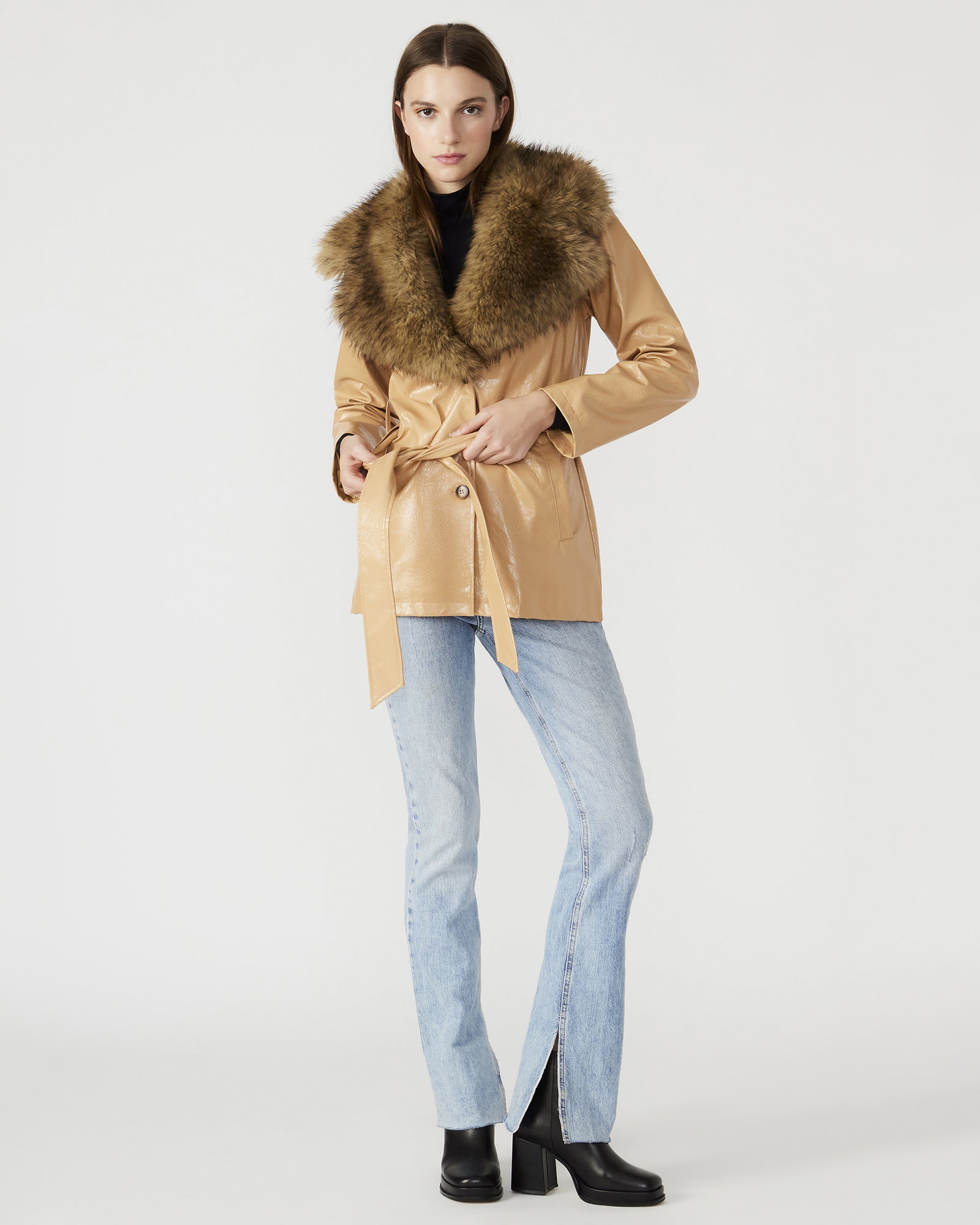 Side view of the tan coat women, highlighting the faux fur collar and button-up closure.