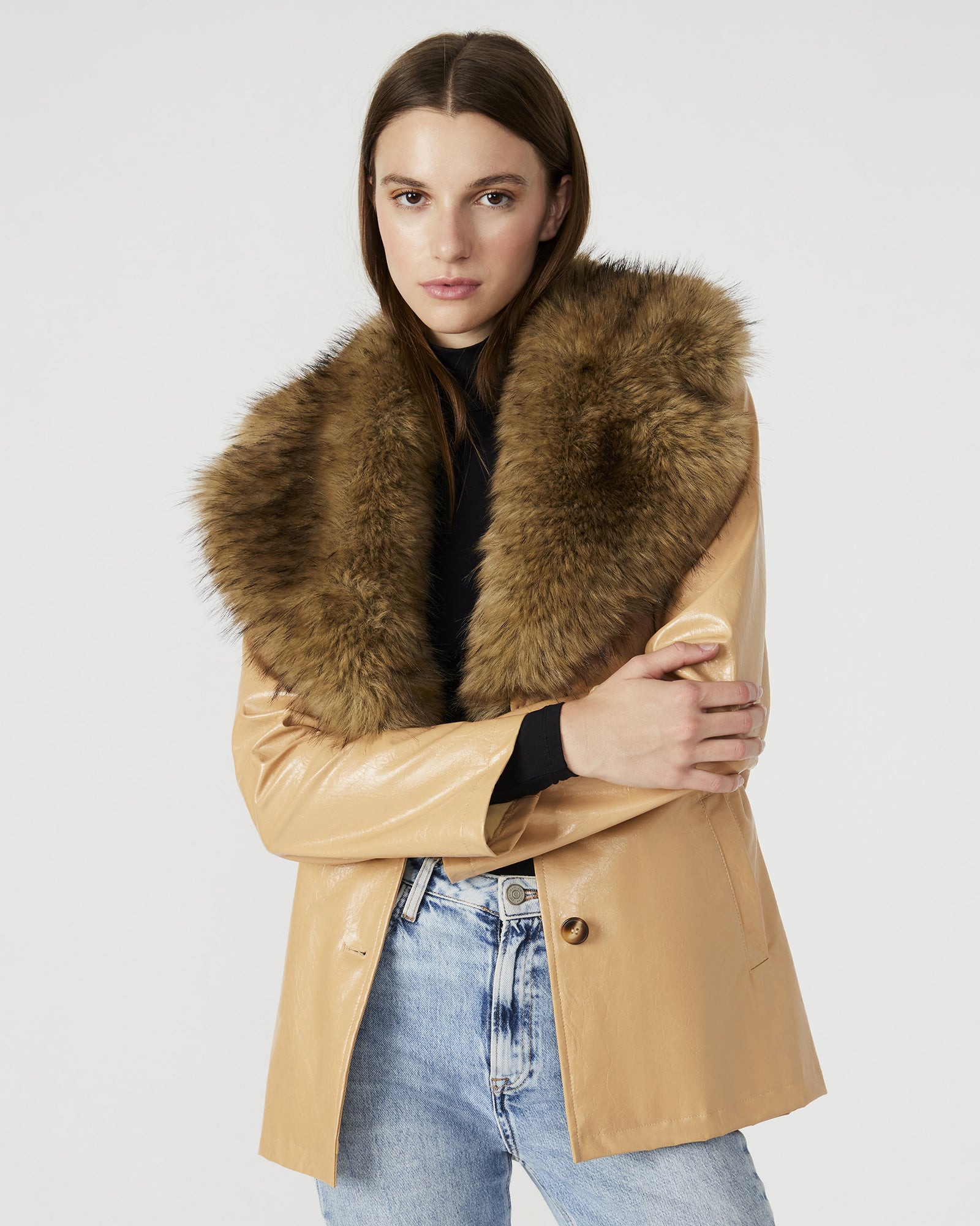 Model wearing the tan trench coat women, demonstrating its stylish fit and functional pockets.