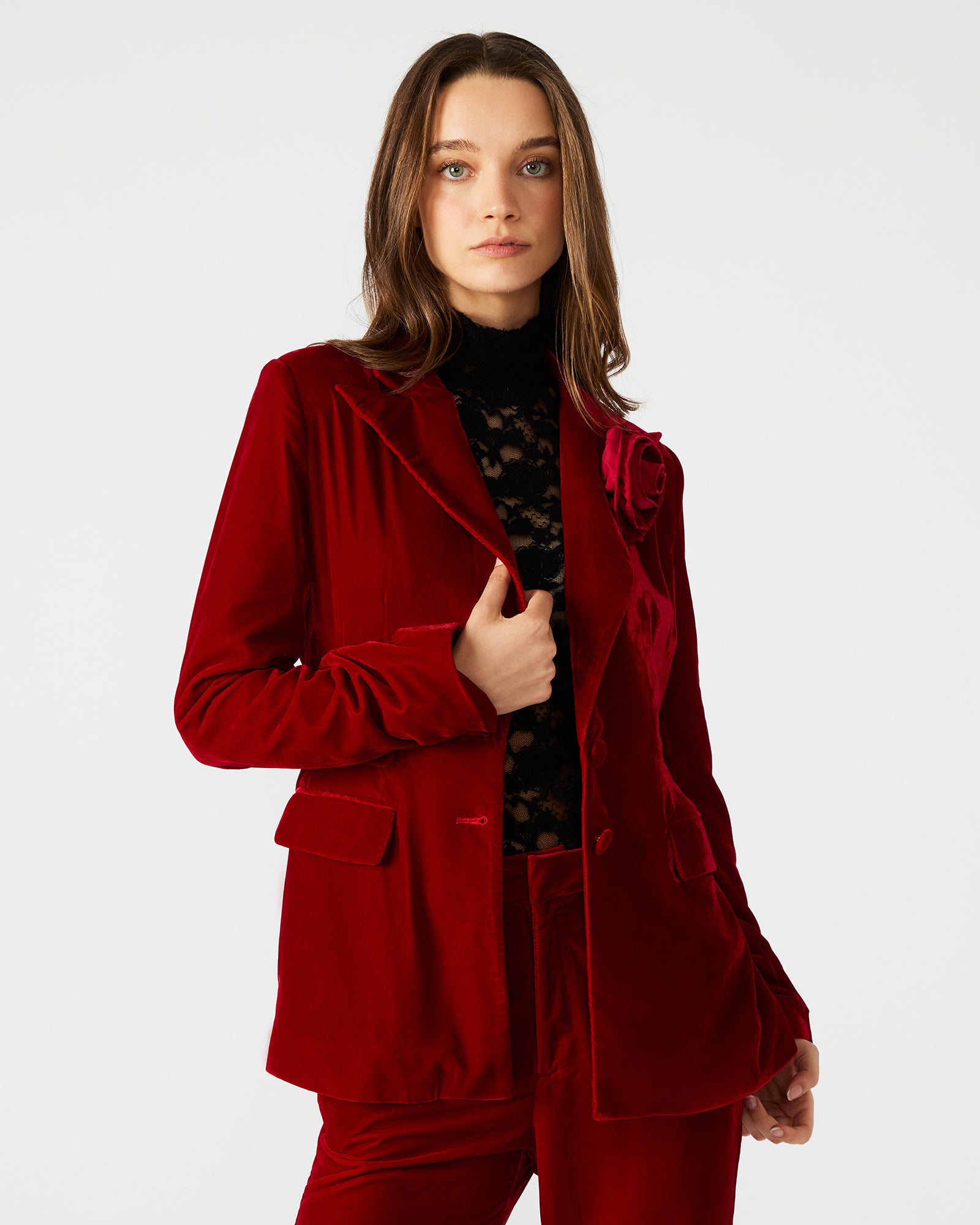 Front view of the elegant red velvet blazer for women, showcasing its rose decal.
