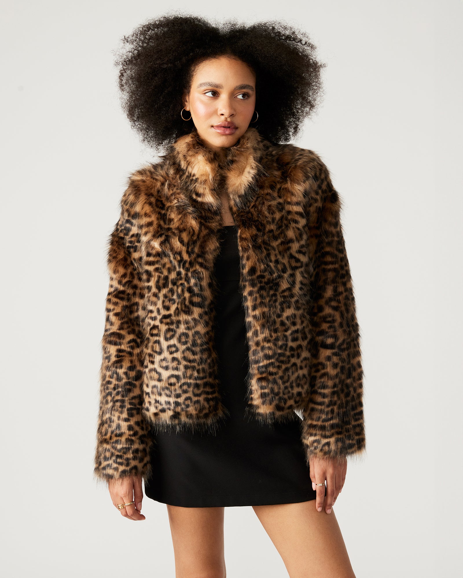 Close-up of leopard print faux fur fabric on women's coat