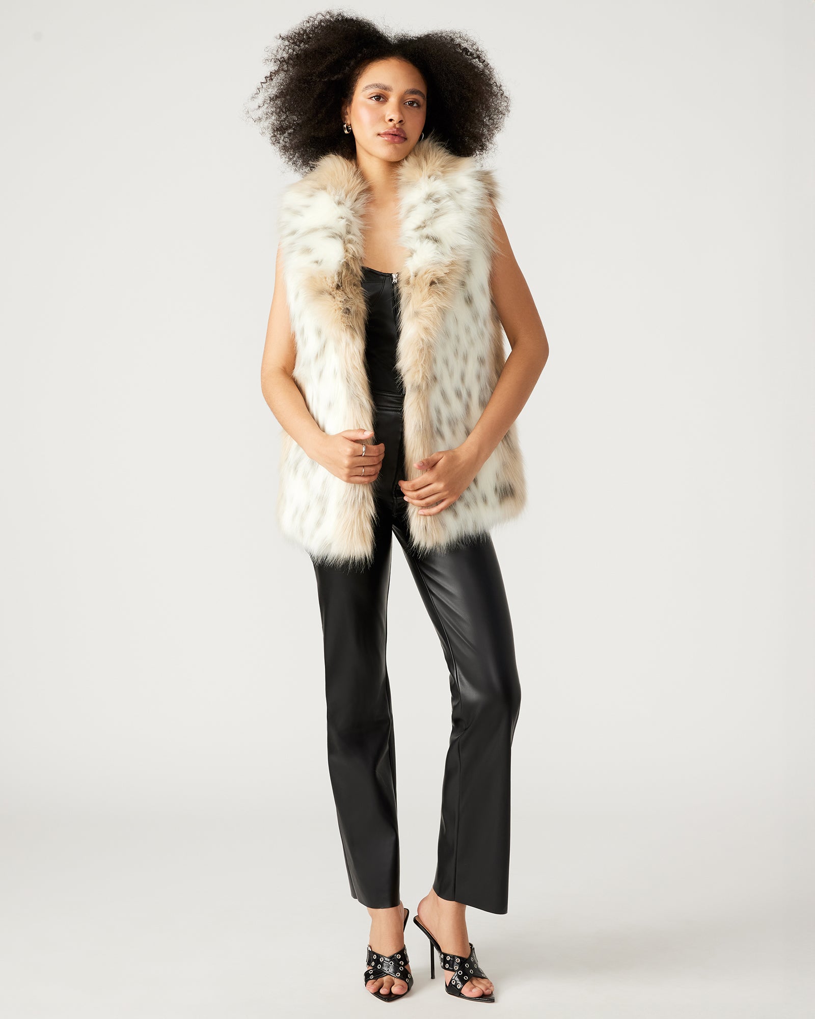 Front view of faux fur vest women wear during chilly urban mornings