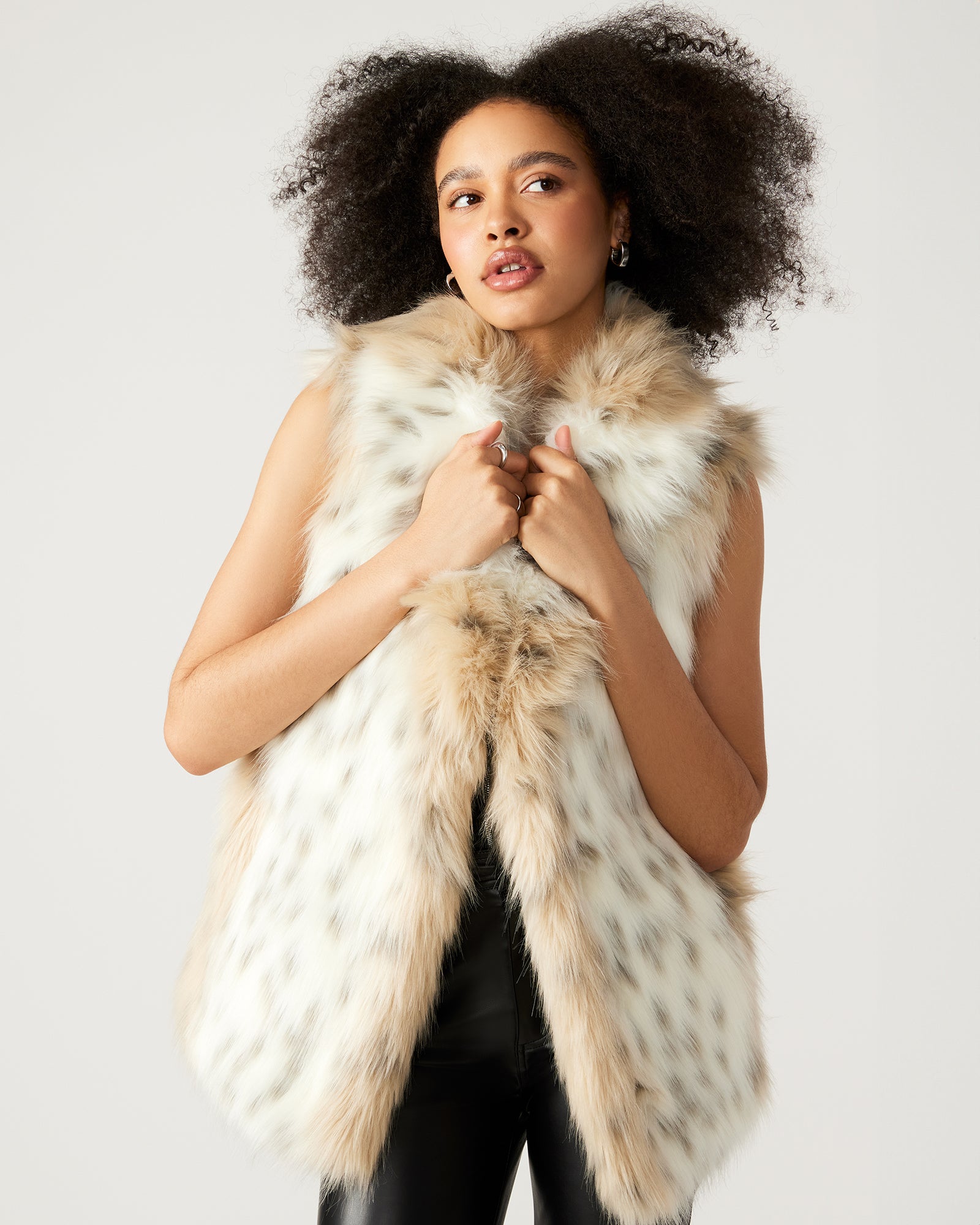 Front view of faux fur vest women wear during chilly urban mornings