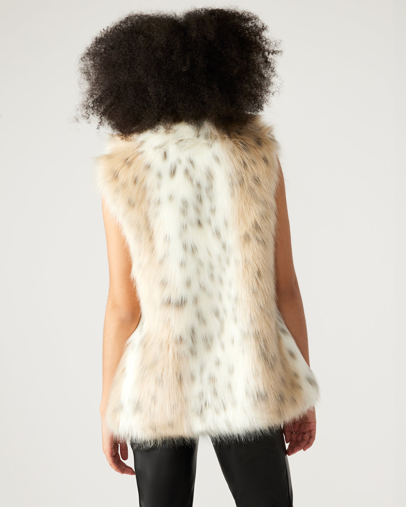 Back angle of womens faux fur vest styled for mob wife aesthetic look
