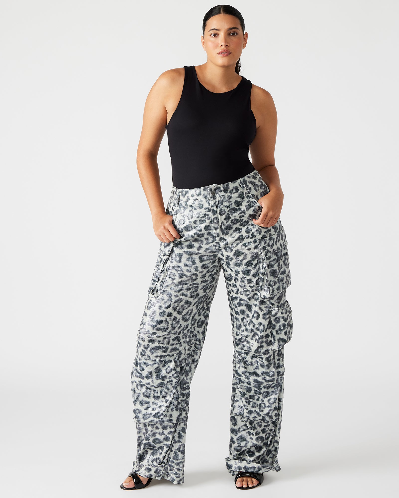 Front view of leopard print sequin cargo pants showcasing adjustable ankle straps.