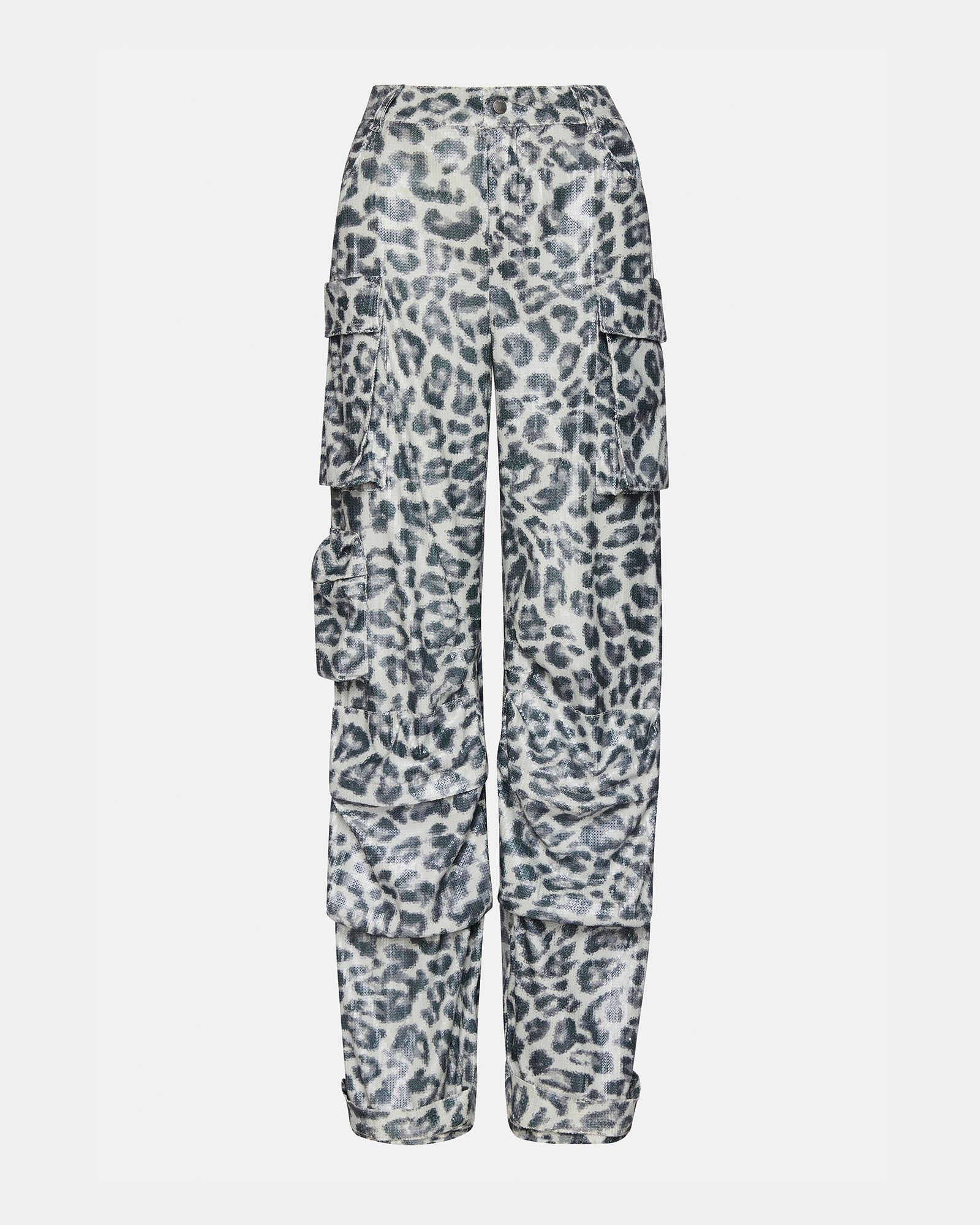 Close-up of cargo pockets on leopard print womens pants, featuring zipper pulls.